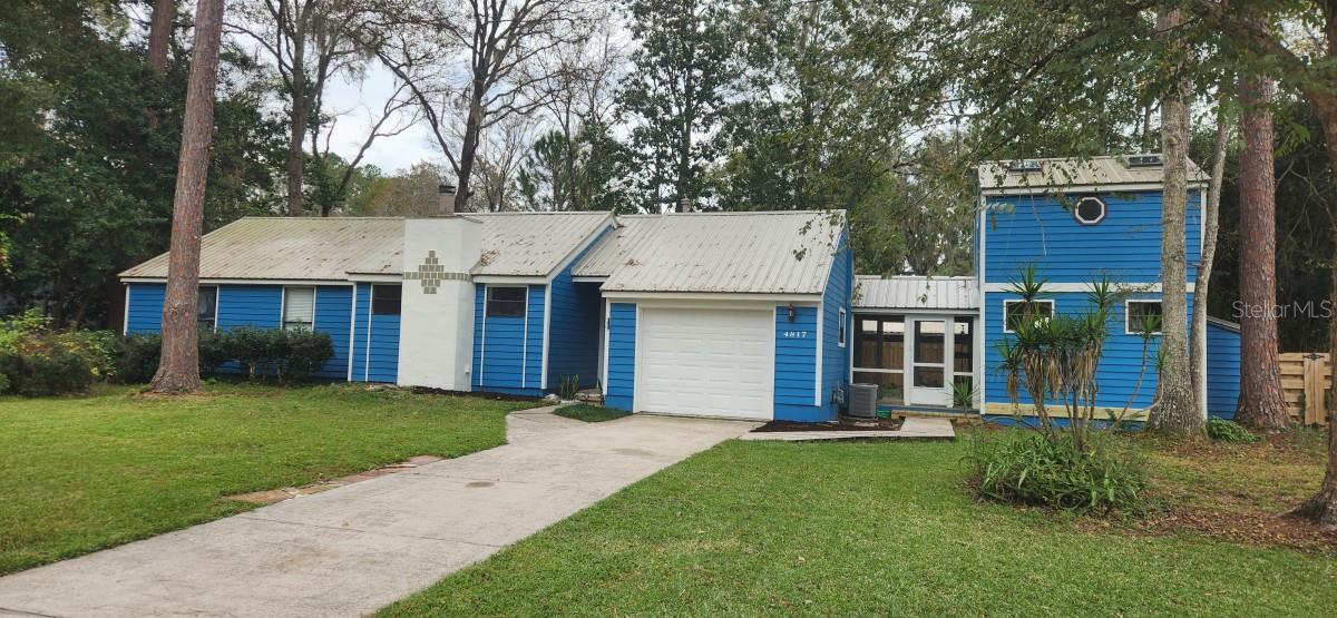 IDEAL FOR WORK FROM HOME! You must see this beautiful 3-bedroom, 2 bath home on a quiet cul-de-sac in a northwest Gainesville neighborhood.  This unique home has a two-story 12’x16’ attached outbuilding, not included in the listed square footage.  It adds 384 square feet, perfect for an office or 4th bedroom with loft.  It also has a new backyard deck and detached screened patio room for outside enjoyment without pests!  Updated features include new metal roof, new decking, new carpet, new tile in the dining room, new exterior and interior paint, and a privacy fence.  New AT&T fiber internet connectivity available! Working fireplace, skylights in bathrooms and outbuilding, and a one-car garage with large, decked attic storage area.  The kitchen features wood cabinet doors, gas stove, pantry, butcher block and stainless prep table and pot rack. School zone:  Glen Springs Elementary, Fort Clark Middle, and Buchholz High.