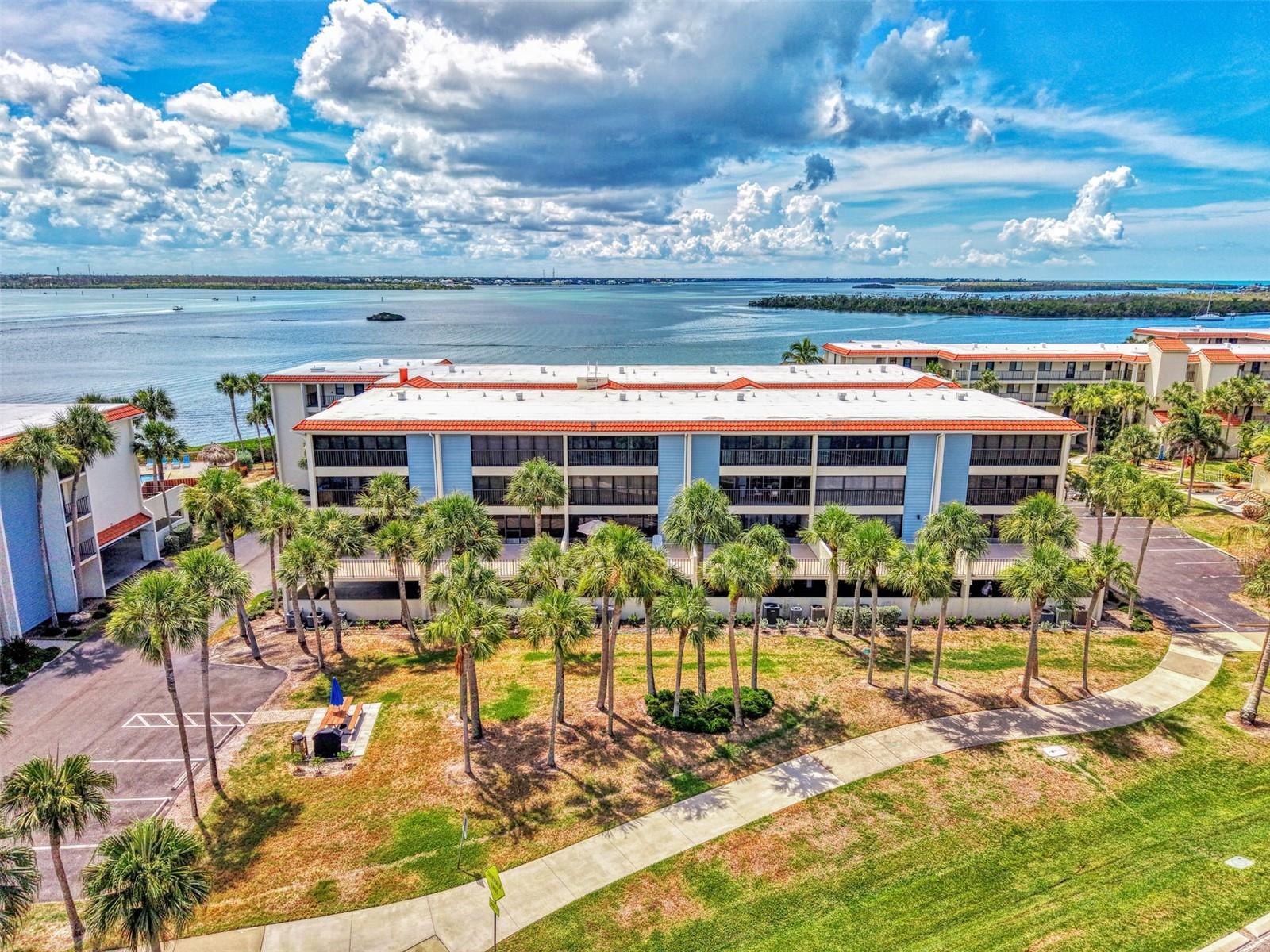 Welcome to paradise at Sandpiper Key on beautiful Manasota Key! This beautifully renovated, turnkey furnished 2-bedroom, 2-bath condominium is truly move-in ready—just bring your suitcase and start enjoying the Florida lifestyle.

The stunning remodeled kitchen features white shaker cabinetry extending to the ceiling, solid granite countertops, abundant storage, and an open design perfect for entertaining. The spacious floor plan offers luxury vinyl flooring throughout kitchen, dining area, living room and primary bedroom and wall to wall carpet in 2nd bedroom, tile in lanai, fresh interior paint, and numerous recent updates including a new A/C (2024), new drywall (2024), new tile flooring (2024), and a beautifully tiled primary shower (2024). In unit laundry.

Enjoy peace of mind knowing the association has successfully passed Florida's State-Mandated Milestone Structural Inspection with no repairs required and has fully established the required reserve funding.

Sandpiper Key offers exceptional resort-style amenities including elevator access, covered garage parking, private storage for beach and fishing gear, bicycle, kayak and paddleboard storage, ample guest parking, two heated/cooled swimming pools for year-round enjoyment, a fishing dock, gas grilling areas, clubhouse/library with an active social calendar, and an on-site rental office. Launch your kayak right from the community and enjoy easy access to the surrounding waterways.

Located just a half-mile stroll along a well-maintained sidewalk to Englewood Beach, you'll love being close to the crystal waters of the Gulf of Mexico, waterfront restaurants, live entertainment, and two local restaurants that even provide complimentary shuttle service from the community.

For boating enthusiasts, the Sandpiper Key Yacht Club is located directly across the street and features 60 privately owned boat slips with direct access to Lemon Bay, the Intracoastal Waterway, and the Gulf of Mexico. Boat slips are privately owned, and opportunities to purchase one are often available.

Whether you're searching for a full-time residence, winter retreat, or investment opportunity, this exceptional condominium offers the perfect combination of luxury, convenience, and coastal living.

Priced to Sell! Schedule a showing today!