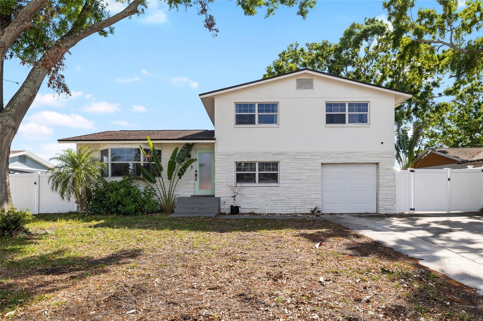 Welcome to one of Tampa's most compelling turn-key, waterfront opportunities, with a canal view and private screened in pool. Whether you are searching for a show-stopping primary residence, a high-performing short-term rental, or the ultimate Florida getaway, 10716 Donbrese Avenue delivers on every front. The chef's kitchen is the first thing that catches your eye, outfitted with marble countertops, a pot filler, brass hardware, a large island, and premium appliances that make cooking feel like an event. The living spaces are just as impressive, with ceilings that soar overhead, wall-to-wall windows that bathe every room in natural light, and a wood-burning fireplace that adds warmth and character. Four bedrooms are spread across multiple levels, giving everyone their own space, while the primary suite offers a quiet, luxurious retreat with an en-suite bath. Step outside and the property truly comes alive. A screened-in lanai with an outdoor wet bar and pool creates the perfect backdrop for entertaining.