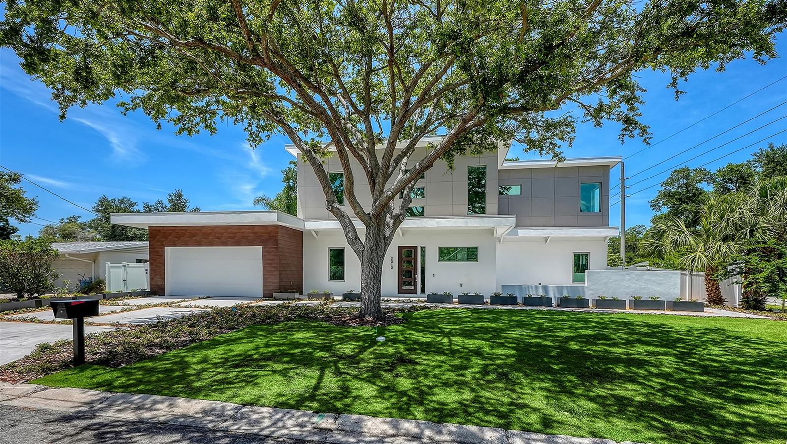 A statement of modern luxury and elevated Florida living, this newly constructed residence blends sophisticated design, expansive indoor-outdoor spaces, and an exceptional location, Situated on a prominent corner lot in Arlington Park, this stunning two-level home was thoughtfully designed to deliver comfort, functionality, and a true resort-style lifestyle experience. Featuring 5 bedrooms, 5 full bathrooms, and 1 half bath, this residence offers approximately 3,515 square feet of interior living space and over 5,834 total square feet including expansive outdoor living areas, balcony spaces, pool area, and garage. The first level features approximately 1,825 square feet thoughtfully distributed across the luxurious primary suite, an additional guest bedroom and full guest bath, spacious open-concept living areas, and a beautifully designed chef's kitchen with premium finishes, custom cabinetry, oversized island, and seamless connection to the outdoor entertaining spaces. An elevator provides convenient access between both levels, adding comfort and sophistication to the home. Step outside into your private backyard oasis featuring a resort-style pool, lush landscaping, and multiple outdoor areas designed to embrace the Florida lifestyle. One side of the property showcases a beautiful oak tree and garden setting, creating a peaceful natural atmosphere ideal for relaxing with family, friends, and pets. The second level offers approximately 1,690 square feet and includes an additional primary suite, two spacious guest bedrooms, and access to an incredible balcony designed to enjoy Sarasota's year-round sunshine and indoor-outdoor living experience. Situated on an oversized 10,200 square foot corner lot, this property offers the perfect balance between luxury, privacy, and outdoor enjoyment. Ideally located just steps from Arlington Park, minutes from Sarasota Memorial Hospital, Southside Village, Downtown Sarasota, and the world-renowned beaches of Siesta Key, this home combines luxury, location, and lifestyle in one of Sarasota's fastest-growing and most desirable neighborhoods. Schedule your private showing today and experience one of Arlington Park's most exciting new luxury offerings.