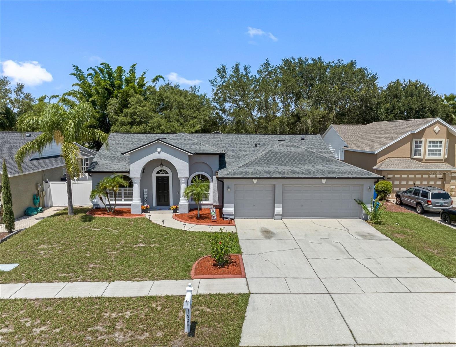 Gorgeous home in the highly sought after community of Lakes of Cristina in central Riverview.  Within walking distance to Riverview High School this home offers four bedrooms, 2 bathrooms, a three/car garage and an office/den all situated on an over-sized lot.  Step through the front door to a formal dining area and office.  The great room is open and spacious with sliding glass doors leading out to a screen enclosed porch.  Art niches and planter shelves adorn the home creating a distinction between this semi-custom design and other homes.  The kitchen has been updated with dark wood cabinets, granite counter tops upgraded lighting and newer appliances.  Beautiful laminate floors have been added throughout resulting in a carpet free home.  Perfect for a family, there are three secondary bedrooms, located away from the private master bedroom suite.  The secondary bathroom has an exit onto the back porch in preparation for a future pool.  The master suite is large enough to accommodate king-sized furniture, has a walk-in closet with additional shelving and a bathroom with dual sinks, a custom tub and separate shower stall.  An indoor laundry room leads to a full three car garage.  Freshly painted on the interior, this home is move-in ready.  The back yard is huge with a 22' x 14' concrete slab perfect for playtime of all kinds.  The HVAC system as well as the roof are 5 years old.  The exterior was painted four years ago.  With NO CDD and a low annual HOA fee this home offers it all.  Call to schedule your appointment today!