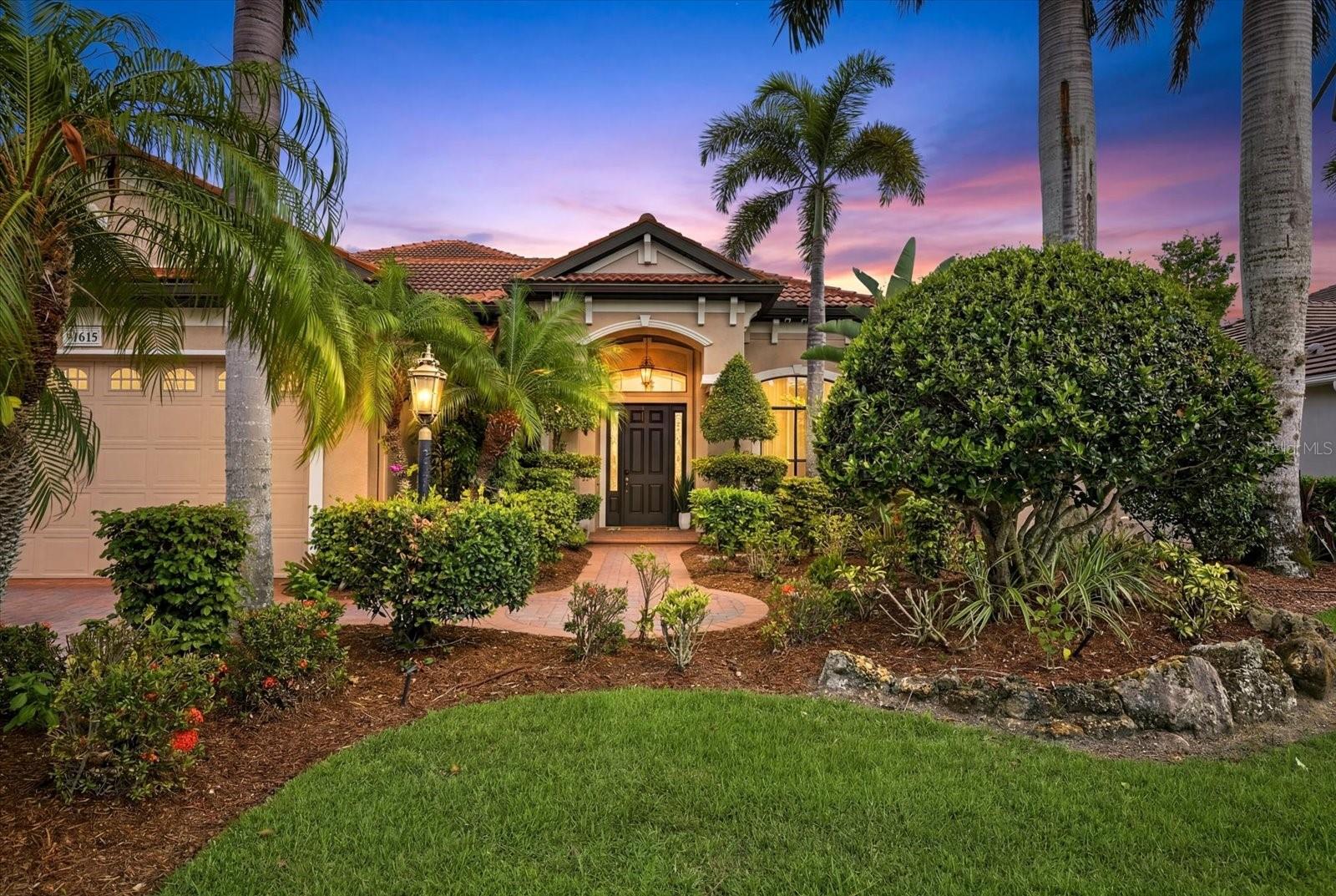 Situated on one of the most desirable homesites in the community, this exceptional six-bedroom, four-bathroom residence captures breathtaking views of a sparkling lake and protected preserve, creating a private and tranquil setting rarely found in Lakewood Ranch.

Designed with both everyday living and entertaining in mind, the home offers an expansive and versatile floor plan featuring four bedrooms, including the primary suite, on the main level, along with a dedicated game room that could easily serve as a second office, media room, or flex space. Upstairs, you'll find two additional bedrooms and a spacious bonus loft, providing the perfect retreat for family and guests.

Soaring 10- and 12-foot ceilings, abundant natural light, and an open-concept design create a bright and welcoming atmosphere throughout. At the heart of the home is a beautifully appointed kitchen that will impress aspiring chefs and entertainers alike, offering an ideal gathering space for friends and family while seamlessly connecting to the surrounding living areas.

The luxurious primary suite offers a peaceful escape, while the upper level features a private balcony that overlooks the resort-style outdoor living space and showcases serene views of the water, preserve, and surrounding natural beauty.

Step outside to your own private backyard retreat where luxury and nature come together seamlessly. The oversized solar-heated pool and spa serve as the centerpiece of an extraordinary outdoor living area complete with a dramatic rock waterfall feature, an expansive travertine deck, and a ClearView lanai screen that preserves uninterrupted views of the lake and the preserve beyond. Entertain year-round from the fully equipped outdoor kitchen, gather around the impressive two-sided fireplace on cooler evenings, or simply relax poolside while enjoying the peaceful sounds of the waterfall and the privacy of the surrounding natural setting. Designed for both large gatherings and intimate evenings at home, this outdoor space delivers the ultimate Florida lifestyle experience.

Mature landscaping enhances the home's curb appeal and reflects the pride of ownership and meticulous care invested throughout the property.

Located in one of Lakewood Ranch's most sought-after neighborhoods, residents enjoy the perfect balance of luxury living and everyday convenience. Shopping, dining, parks, and top-rated schools are all just minutes away, including one of the area's most highly regarded middle schools within walking distance.

This is more than a home—it's a lifestyle defined by privacy, space, comfort, and exceptional views.
