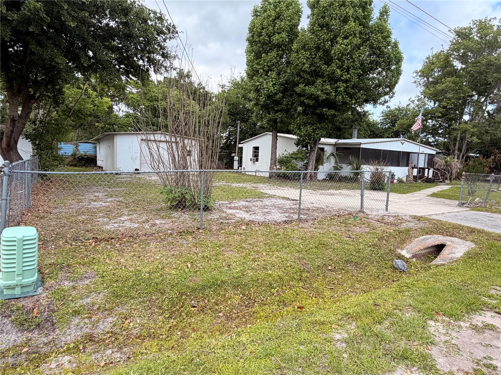 Excellent investment opportunity!  This 3-bedroom, 2-bathroom home offers 1,456 square feet of living space and is the perfect property for those looking to remodel and add value. Situated on an oversized lot with a fully fenced yard, the property provides plenty of room for outdoor living, storage, or future improvements. The home features a spacious 36’x6’ front screened-in porch, ideal for enjoying Florida’s natural surroundings, as well as a large 26’x10’ rear enclosed porch that adds additional usable space. A detached garage/workshop offers excellent potential for hobbies, storage, or workspace needs. With a solid layout and desirable features already in place, this property is ready for your vision and updates. Conveniently located near the St. Johns River, you’ll enjoy easy access to boating, fishing, and all the outdoor activities Astor is known for. Whether you’re an investor, flipper, or buyer looking to create your own space, this property presents a fantastic opportunity with endless potential. An additional single lot located next door is also available for purchase, offering the potential to create a rare triple-lot property. MLS# R4911153
