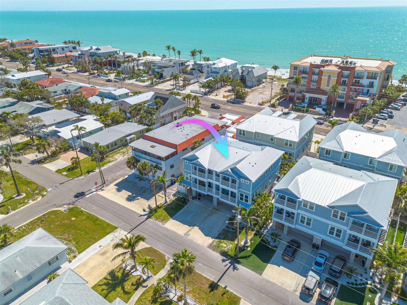 NO HOA & SHORT TERM RENTALS ALLOWED! This stunning newer construction beach townhouse offers the ultimate coastal lifestyle—just steps from the sugar-white sands of Redington Beach! The first living area is ELEVATED 15+ feet above base flood elevation, this beautifully designed 3-bedroom, 2.5-bath home is located on a quiet residential street near two community parks. Inside, you'll find dramatic 10ft ceilings, an open-concept living space, and a private elevator for ultimate convenience. The gourmet kitchen is a chef’s dream, featuring quartz countertops, soft-close cabinetry, a 5-burner gas cooktop, double ovens, and an impressive 29 feet of counter space! The adjacent pantry is perfect for additional storage or a fine spirits collection. A light-filled sunroom off the family room provides a cozy retreat for reading, working, or entertaining. Throughout the main level, durable hardwood flooring enhances the home's beauty and ease of maintenance. Upstairs, the luxurious owner’s suite boasts a spacious walk-in closet, elegant quartz countertops, custom tile work, and a sleek glass shower. Each bedroom features its own walk-in closet, while built-in laundry storage and multiple closets throughout the home maximize space and organization. Enjoy the Florida sunshine from two private balconies or the fenced backyard, ideal for pets and outdoor gatherings. After a day at the beach, rinse off in the outdoor shower before stepping inside. Additional features include an oversized two-car garage with extra storage. Built in 2018, this low-maintenance home is a perfect full-time residence, vacation getaway, or investment opportunity with no rental restrictions! Don't miss this rare chance to own a beachside townhome with NO HOA fees! Schedule your private tour today. NEW HVAC!!