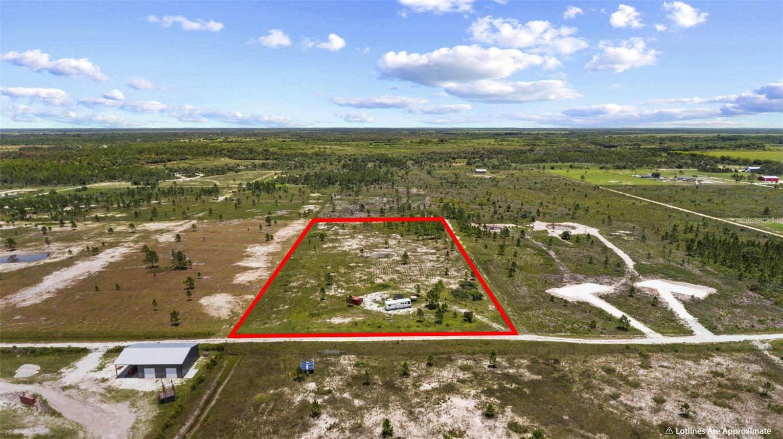 Discover the perfect blend of rural serenity and limitless opportunity with this highly improved, 5-acre parcel located in the peaceful Charlotte Harbor Highlands at 49021 Bermont Rd. Whether you are dreaming of a self-sustaining homestead, an equestrian estate, an active agricultural farm, or a private recreational retreat, this property is primed and ready to bring your vision to life. With valuable improvements already in place, this is a rare chance to own a piece of Southwest Florida’s pristine countryside.

The entire 5-acre parcel has been fully cleared for years and is completely fenced, featuring rich Oldsmar fine sand soil that is ideal for lush pastures, farming, or large-scale gardening. Sitting at an impressive 60-foot elevation, this property is completely outside of the flood zone, giving you peace of mind knowing your land is high and dry. FPL power lines are already running to the property, saving you significant time and upfront setup. Access is secure and guaranteed via a legal 60-foot ingress/egress easement on a well-maintained, private road, located just a half-mile south of the main paved State Road 74.

You will enjoy ultimate freedom here, as the land is zoned Agricultural with no homeowner's association and no deed restrictions. This flexible zoning permits over a hundred uses, allowing you to build a traditional site-built home, a modular home, or a mobile home. It fully supports barns, agribusiness, livestock, horses, and conservation efforts. As an outdoor enthusiast’s dream, the property is surrounded by wildlife and privacy, offering direct access to the open marshlands to the east. It is perfect for ATVs, hunting, hiking, and soaking in the quiet country nights.

Enjoy the ultimate "off-the-grid" feel without sacrificing modern convenience. The land is perfectly situated between the historic waterfront charm of Punta Gorda and the expanding amenities of North Fort Myers. You are just five minutes from the Babcock Ranch Preserve public access and the Redneck Mud Park, 15 minutes to local shopping and Interstate 75, 20 minutes to the dining and coastal adventures of downtown Punta Gorda, and about 40 minutes from Fort Myers. Whether you are an investor, a homesteader, or simply looking for a generational family retreat, 5-acre tracts with this level of preparation, elevation, and freedom rarely hit the market.