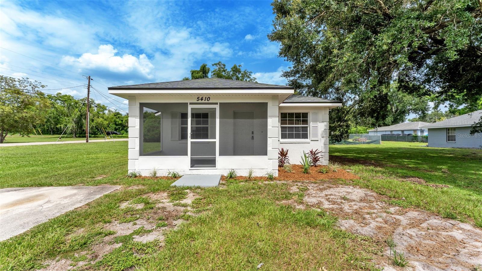 Virtually Staged. Welcome home to this beautifully renovated gem in the heart of Lakeland! Thoughtfully upgraded from top to bottom, this move-in ready home offers the perfect blend of modern style, quality craftsmanship, and everyday comfort.  From the moment you arrive, you'll appreciate the fresh exterior paint and inviting screened front porch. Step inside to discover a bright, refreshed interior featuring fresh paint throughout, upgraded lighting, new ceiling fans, and new interior doors that create a clean, contemporary feel. This charming home features three bedrooms and one bathroom, offering a comfortable and functional layout for everyday living.  The stunning kitchen has been completely remodeled and showcases gorgeous quartz countertops, modern cabinetry, and stylish finishes that make cooking and entertaining a pleasure. The fully renovated bathroom has been beautifully updated with today's most desirable design elements, creating a spa-like retreat.  Enjoy the peace of mind that comes with major system upgrades, including a brand-new roof, new air conditioning system, and new water heater—allowing you to move in with confidence for years to come.  Conveniently located in the heart of Lakeland, you'll enjoy easy access to shopping, dining, parks, schools, medical facilities, and major commuter routes while still enjoying the comfort of a quiet residential setting. Whether you're a first-time homebuyer, looking to downsize, or searching for an outstanding investment opportunity, this turnkey property checks all the boxes.  Don't miss your opportunity to own a fully remodeled home where all the hard work has already been done—schedule your private showing today!