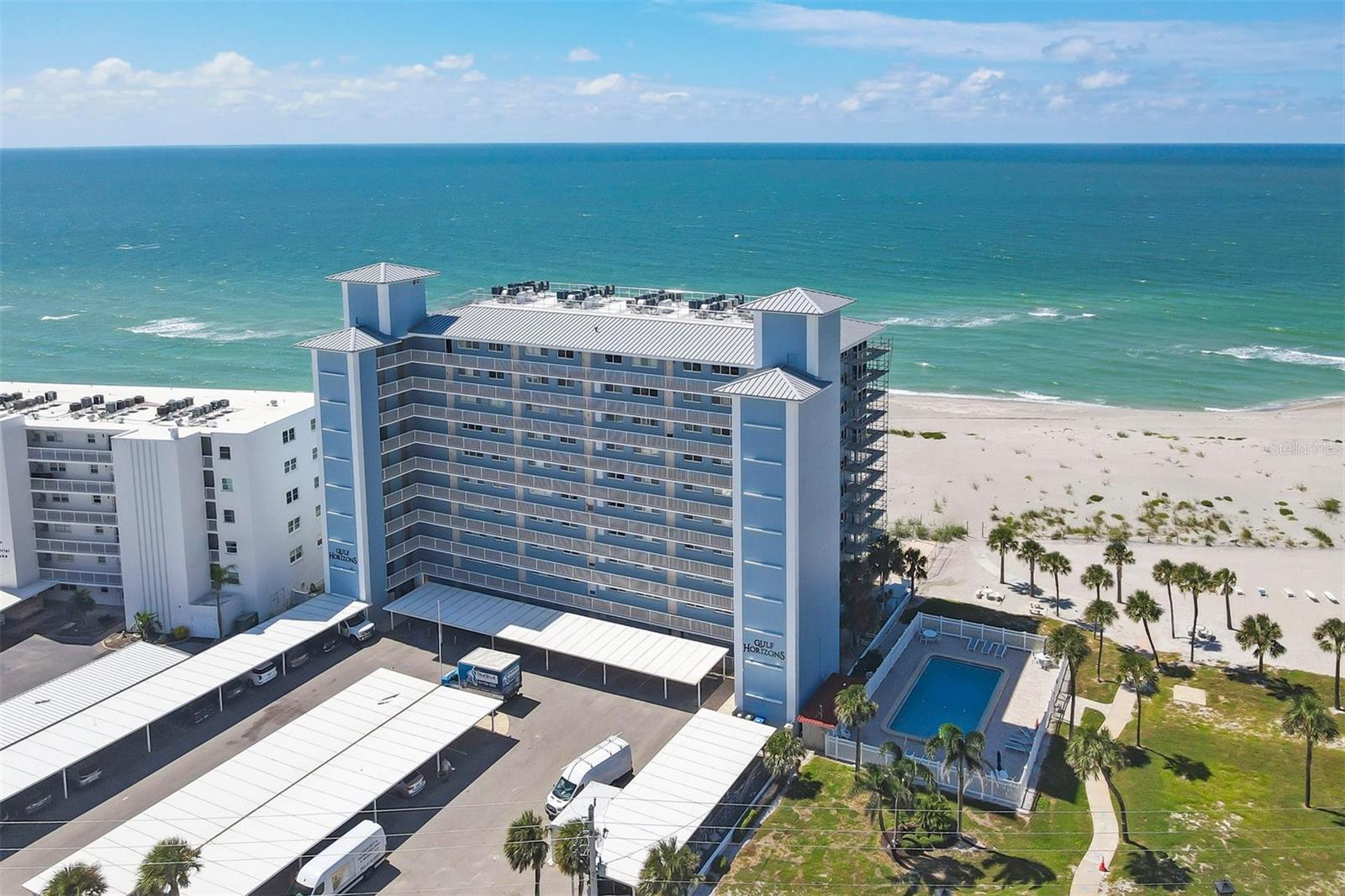 One or more photo(s) has been virtually staged. Live the coastal lifestyle reimagined at Gulf Horizons, a beautifully restored beachfront community on historic Venice Island! This third-floor corner residence at 555 The Esplanade North captures panoramic Gulf of Mexico views and effortless elegance in every detail. Spanning 1,195 square feet, the two-bedroom, two-bath home is infused with light and designed for comfort. Recent interior enhancements include a full suite of Frigidaire kitchen appliances, custom cabinetry, updated countertops and new faucets in both the kitchen and baths. Luxury vinyl plank flooring, new ceiling fans and a York five-ton air-conditioning unit elevate everyday living, while hurricane-impact windows and sliding glass doors provide peace of mind. The building itself has recently completed a full-scale renovation following Hurricane Milton, with modernized systems and refreshed common areas designed to enhance both resilience and visual appeal. Step onto the private balcony and take in uninterrupted sunset vistas or enjoy the direct access to the sandy Gulf shoreline just steps away. Beyond your front door, the boutiques, cafes, restaurants and cultural charm of downtown Venice are just moments away. This is more than a residence. It is a refined retreat where modern luxury meets timeless coastal beauty!