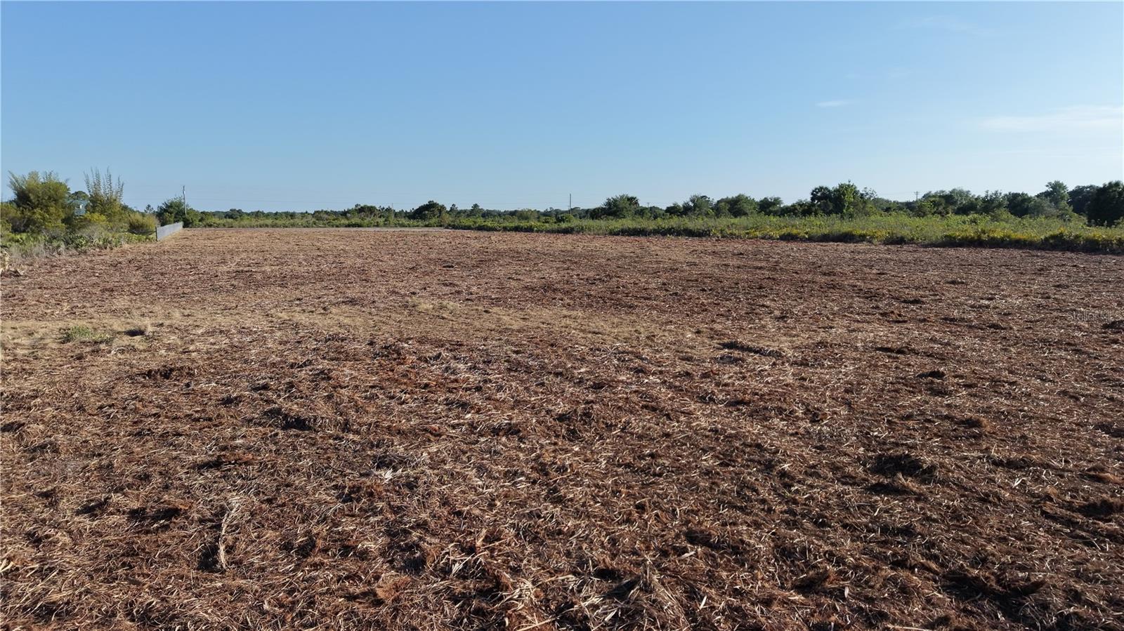 3 acres COMPLETELY CLEARED, just off the paved road! NO flood zone, and on a very well developed block with some site built homes nearby. This is a premium lot, exactly what you have been looking for. A lot of money has already gone into preparing this land for your home. Just 3 lots over from the paved road. Mobile/Manufactured homes are allowed. There are 2 parcels included in this sale, so you could build 2 homes. The address of the 2nd lot which is included in the sale and connected end-to-end, is 19026 NW 254TH ST Okeechobee. Road access is better on the 252nd street side, so we recommend using that side for entry and GPS navigation.  Near this neighborhood lies the Kissimmee River Preserve State Park, as well as the Kissimmee River itself, which leads into Lake Okeechobee, famed for some of the finest fishing. Whether your interests lie in fishing, hunting, mudding, agriculture, or simply relishing privacy, this location has it all. Priced to sell quickly.