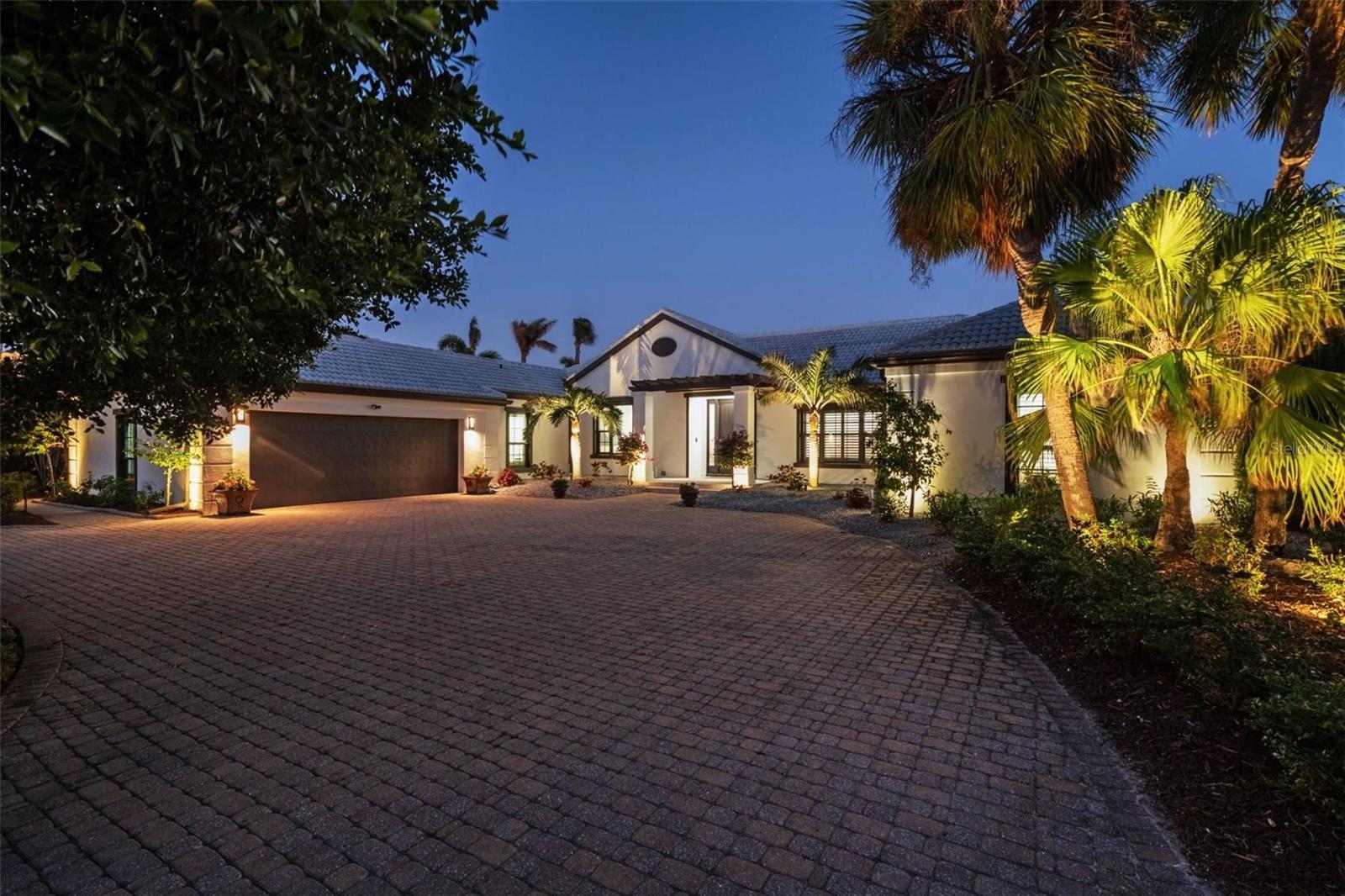 Nestled in the prestigious Bird Key community, The Banyan House is a masterfully reimagined coastal residence that blends timeless design with modern sophistication. From its elevated craftsmanship to its serene ambiance, every detail of this home has been thoughtfully curated to offer both beauty and function. Designed with resilience in mind, the property has never sustained storm damage or flooding—an exceptional testament to its superior construction. A clean 4-point inspection report is also available upon request, offering added peace of mind.

Located just off the iconic John Ringling Bridge, The Banyan House offers a lifestyle defined by convenience, beauty, and exclusivity. From this prime setting, residents enjoy immediate access to Downtown Sarasota, with its world-class dining, cultural venues, and boutique shopping, while the pristine shores of Lido Beach and St. Armands Circle are just minutes away. Whether you're heading out for an evening at the opera, a day on the water, or a quiet morning at a local café, everything is effortlessly within reach.

Inside, natural light fills the home’s open and intelligently designed layout, creating an effortless flow ideal for both everyday living and entertaining. Rich engineered hardwood flooring provides a foundation of warmth and durability throughout, while the custom chef’s kitchen anchors the main living space with premium finishes, high-end appliances, and tailored cabinetry that combines elegance with utility. The entire home is outfitted with a Lutron smart lighting system, enhancing both convenience and ambiance with seamless control. With four bedrooms and three full bathrooms, the home offers a harmonious balance between spaciousness and intimacy.

One of the home’s most distinctive features is the sunroom, where vaulted ceilings and custom wood detailing frame tranquil views of the lush surroundings—a perfect space for relaxing or gathering with guests. Outdoors, the property transforms into a private resort-style retreat. The expansive lanai includes a fully equipped summer kitchen, a covered dining area with remote-controlled hurricane screens, and a large pool and spa, all designed to embrace Florida’s indoor-outdoor lifestyle. The grounds are fully fenced and professionally landscaped, creating a private and picturesque setting with tropical foliage, manicured greenery, and a sense of tranquility throughout.

With 100 feet of private waterfront along a deep-water canal, this is truly a boater’s paradise. A new boat lift and direct access to Sarasota Bay ensure effortless enjoyment of the Gulf Coast waters. Impact-rated windows and doors throughout further enhance the home’s durability and security, while every architectural element reflects a commitment to both style and substance.

The Banyan House presents a rare opportunity to own a home where enduring luxury, thoughtful design, and the relaxed sophistication of Bird Key come together in perfect harmony. Whether as a primary residence or seasonal retreat, this one-of-a-kind property invites you to live beautifully by the water, just moments from the very best of Sarasota.

Extensive feature sheet available upon request.