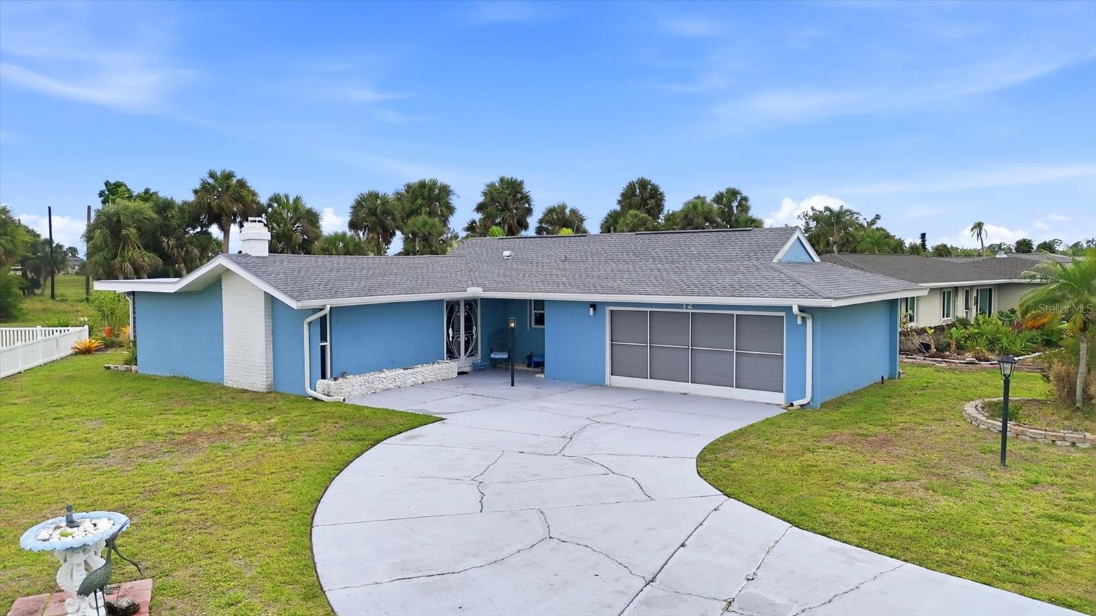 This charming two-bedroom, two-bath bungalow blends character with comfort, featuring open-beamed cathedral ceilings, abundant natural light, newer windows, and updated flooring.

Located on a quiet cul-de-sac with minimal traffic, this home places you right in the heart of a welcoming golf community—bring your clubs and enjoy easy access to the clubhouse and nearby Boca Grande and Gulf beaches.

The spacious family room provides relaxing views of the golf course driving range, while the cozy living room features a rare fireplace—perfect for unwinding at the end of the day. An oversized garage adds exceptional versatility, ideal for storage, hobbies, or showcasing your favorite projects.

The private primary suite offers a beautifully updated en-suite bathroom, creating a comfortable retreat with modern finishes and thoughtful design.

Thoughtfully maintained and move-in ready, the home offers peace of mind with major updates already completed, including a new roof (2022), A/C (2020), updated electrical panel (2019), hurricane protection (2017), and whole-home repiping (2012).