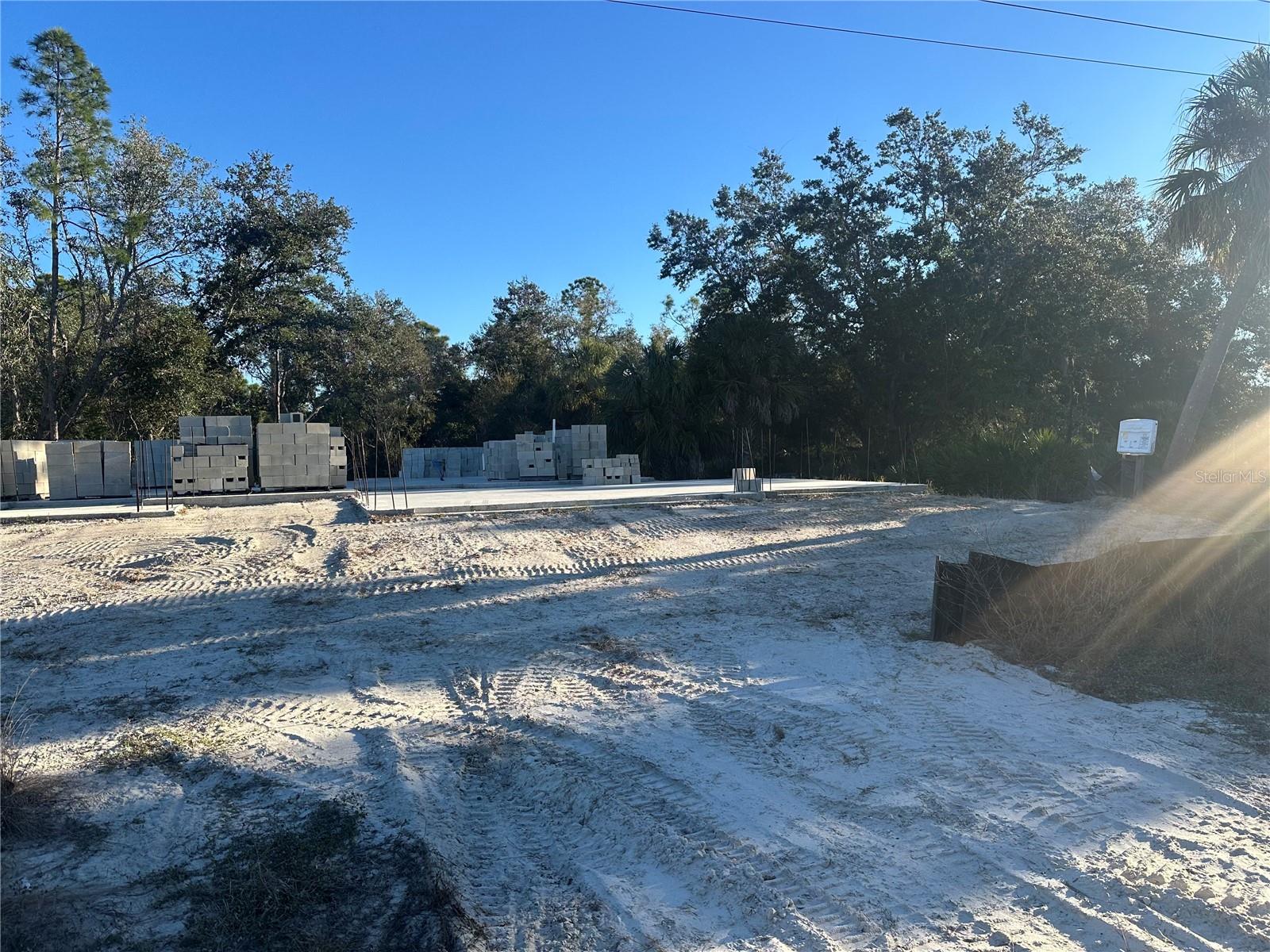 Under Construction. Double Lot Property in the one of the Fastest Growing cities of Florida! You have a rare opportunity to pick your finishes and complete the already started Construction! The lot has been cleared, Beautiful floor plan picked! The Building permits pulled, Slab foundation poured, first stage plumbing done and building blocks already bought!!  This property offers 3 Bedrooms + Office, 2.5 Baths and 3 Car Garage floor plan! with High Ceilings for lots of light! Local Builders are available to help finish the construction! You have an opportunity to Customize YOUR NEW Construction Dream Property! Price includes plans. No Liens on the property!!! Sold As IS.
