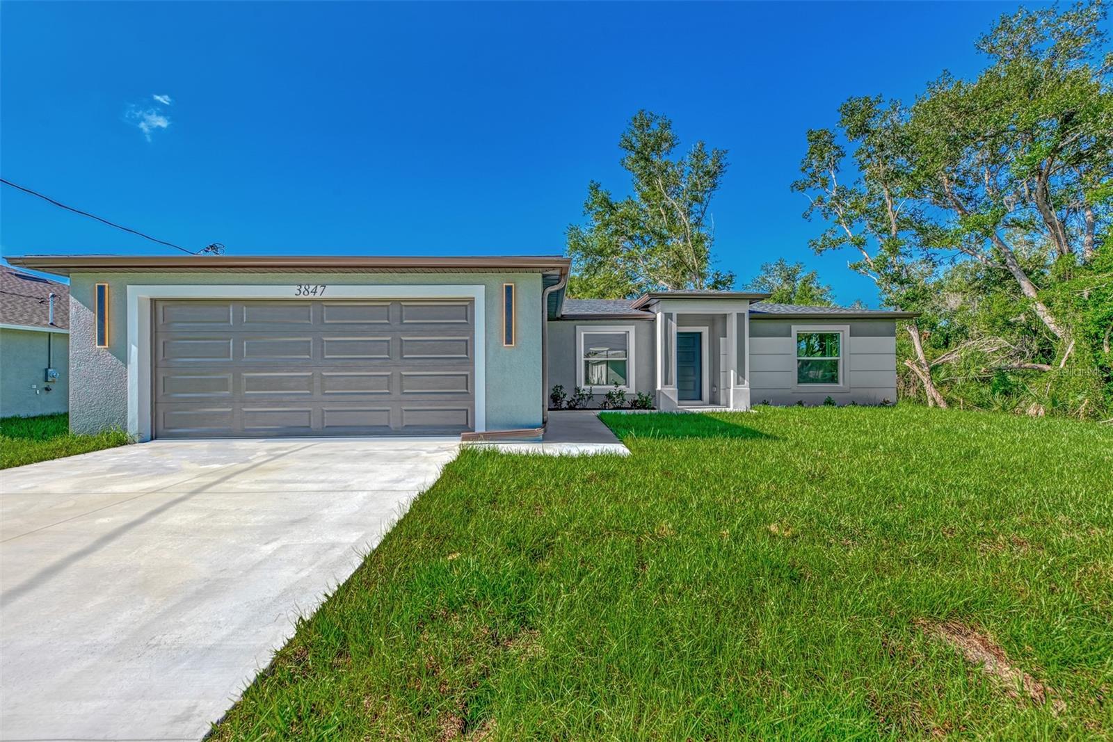 Under Construction. Under Construction. New 3-bedroom, 2-bath home in North Port, FL. This stunning residence features an open floor plan, quartz countertops, soft close cabinets, waterproof vinyl flooring throughout, and stainless steel appliances. The master suite includes a walk-in closet and a luxurious en-suite bathroom with tiled shower walls. Enjoy peace of mind with impact windows and the convenience of a two-car garage. The outdoor space offers ample room for activities. Conveniently located near local amenities, parks, schools, and shopping. Be the first to live in this beautiful home – schedule your showing today!Pictures are from a similar model and finishes may vary. All measurements should be verified by Buyers agent. "Photos are of a similar model. Finishes, features, and colors may vary."
