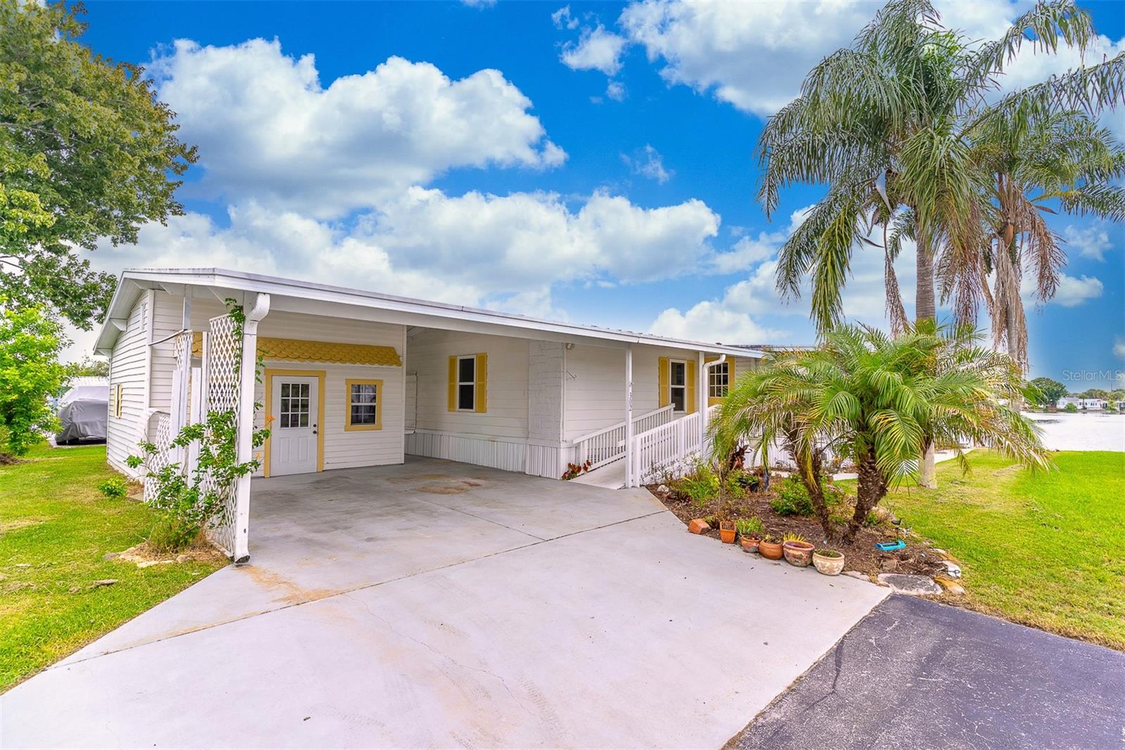 Welcome to your waterfront oasis in Forest Lakes of Cocoa! Located in a highly desirable 55+ community where you own the land, this move-in-ready 2-bedroom, 2-bath home offers 1,480 square feet of comfortable living space and sits on one of the nicest waterfront lots in the neighborhood.

Enjoy breathtaking water views and embrace the Florida lifestyle from your expansive wraparound deck, freshly painted and perfect for relaxing or entertaining. The property also features a private dock and boat slip, allowing you to enjoy boating with an electric motor or fish right from your backyard. Additional outdoor highlights include a covered porch and carport.Inside, you'll find a spacious living room overlooking the water, a bright dining area, an enclosed screened patio, and a well-appointed kitchen.More than just a home, this property offers an exceptional waterfront lifestyle. Forest Lakes residents enjoy a heated community pool, clubhouse, shuffleboard courts, boat ramp, and an active social calendar filled with events and activities. Conveniently located less than a mile from I-95, you'll have easy access to shopping, dining, entertainment, and the beautiful Space Coast beaches.
