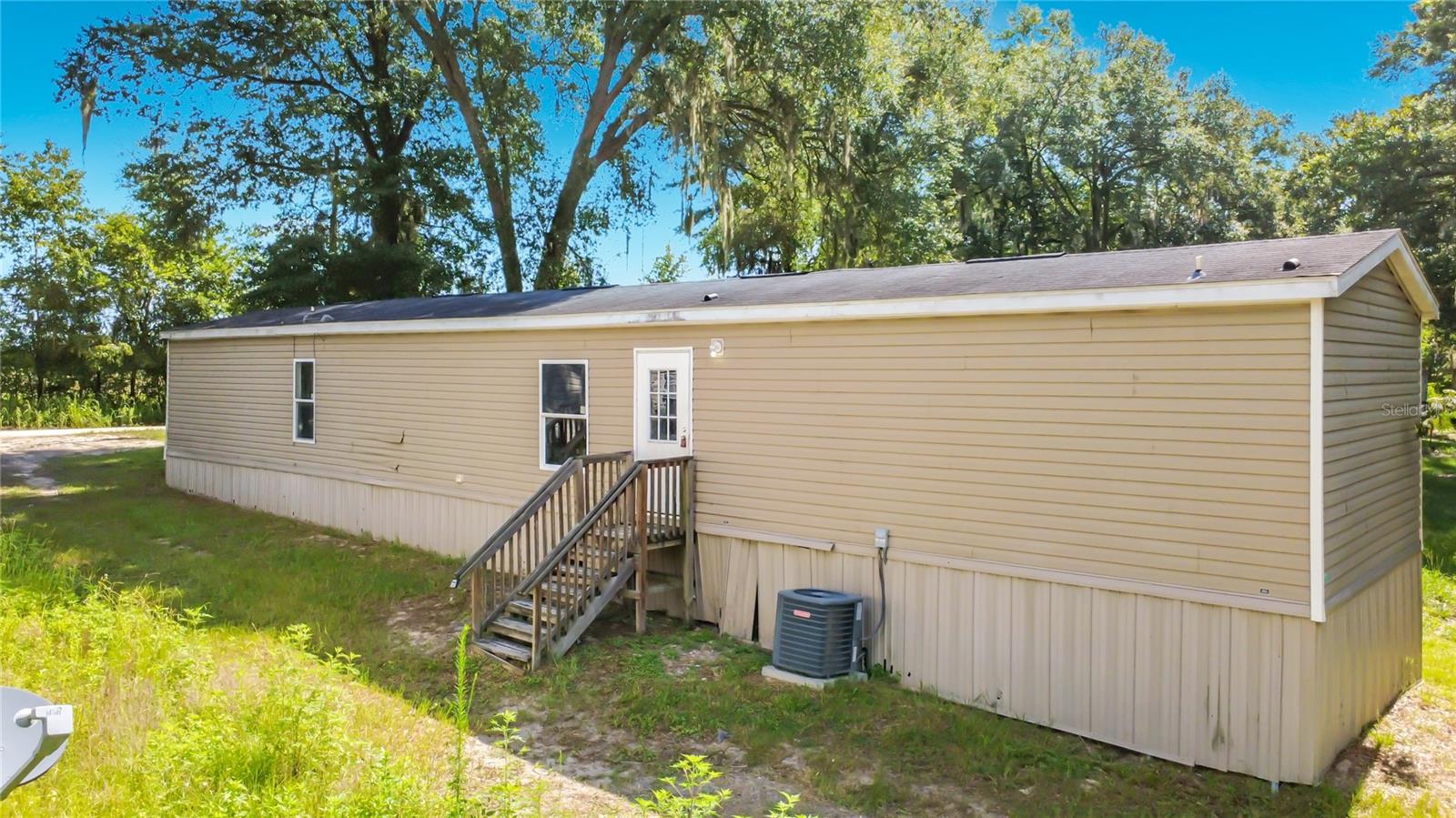 AFFORDABLE STARTER HOME / INVESTOR SPECIAL: LARGE 2017 SINGLEWIDE IN WILLISTON FOR UNDER 100k! THREE
BED AND TWO BATH ON YOUR OWN LAND WITH NO HOA!

NEEDS SOME TLC, BUT WILL BE A GREAT STARTER HOME OR RENTAL PROPERTY WITH A LITTLE ELBOW GREASE.
GOOD ROOF, A/C, DOUBLE PANE WINDOWS THROUGHOUT. COME CHECK IT OUT TODAY!

EQUAL HOUSING OPPORTUNITY.