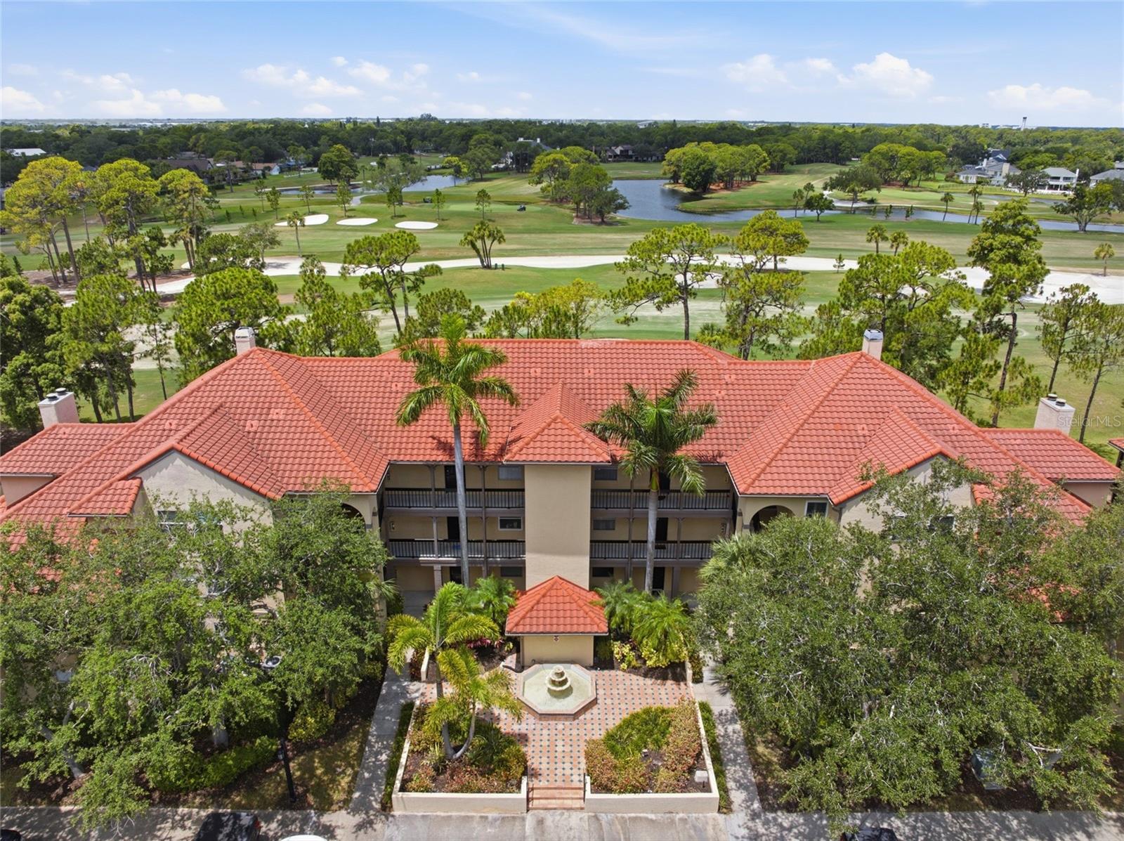 RARE opportunity to own the LARGEST and ONLY two-story townhome-style condominium in the GATED Audubon Community at Feather Sound. This spacious 3-bedroom, 3-bath residence offers the privacy and feel of a townhome, with stunning golf course views, and access to full resort-style amenities in one of Tampa Bay's most desirable locations.

Enjoy sweeping golf course views from two screened-in lanais overlooking the beautiful Feather Sound Golf Course, creating the perfect setting for morning coffee, evening sunsets, or entertaining guests. The spacious floor plan features three bedrooms, each with its own walk-in closet and bathroom, including a primary suite with an en-suite bath. Granite countertops enhance both the kitchen and bathrooms, while inside laundry adds everyday convenience.

Recent updates include: roof (2021), carpet (2023), upstairs A/C (2025), downstairs A/C (2026), new lanai screens (2024), and dishwasher (2024). The Unit comes with 2 assigned parking spots plus a 1 car detached garage located right in front of the building. Ground floor entry, no elevator needed. The home also offers valuable peace of mind, having experienced NO water intrusion during the 2024 hurricanes. 

Beyond the home itself, Audubon offers a true resort-style lifestyle with numerous amenities including heated pool and spa, fitness center, sauna, clubhouse, Cyber Café, tennis and pickleball courts, and an indoor air-conditioned half basketball court.

Located in the heart of Feather Sound, you'll enjoy one of Tampa Bay's most convenient and picturesque communities, featuring a safe and scenic 5K walking loop around the golf course, quick access to downtown St. Petersburg and Award-winning Gulf beaches, and easy commutes throughout the Tampa Bay area. St. Pete-Clearwater International Airport (PIE) is just 5 minutes away, while Tampa International Airport (TPA) is only 15 minutes away.

Whether you're seeking a primary residence, seasonal retreat, or low-maintenance Florida lifestyle, this one-of-a-kind home offers a rare combination of space, views, amenities, and location.
