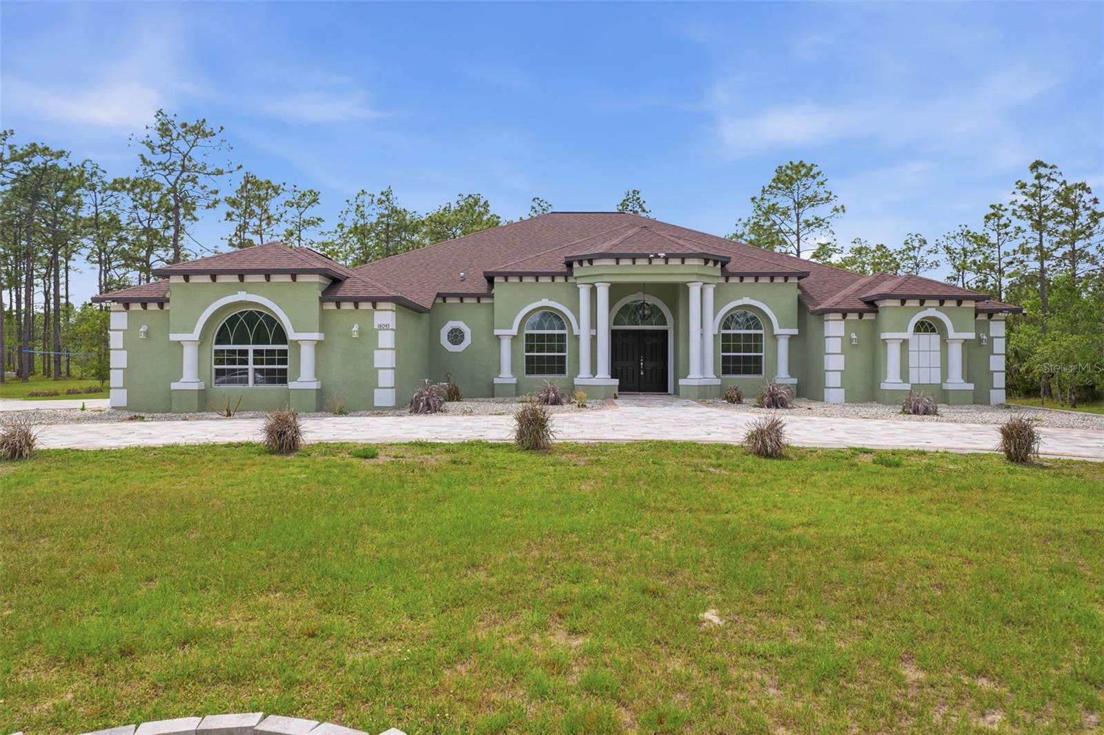 Step into this beautiful 4 bed 3 bath custom designed home where thoughtful upgrades and inviting spaces come together to create a truly comfortable living experience. A bright, open layout welcomes you with natural light, stylish finishes, and a seamless flow ideal for both everyday living and entertaining.

The heart of the home is the modern kitchen, featuring upgraded countertops, quality cabinetry, and a spacious island perfect for gatherings. The adjoining living and dining areas have warmth and versatility, making it easy to host or unwind.

The primary suite serves as a private retreat with a generous layout, walk-in closets, and a spa-inspired bathroom. Additional bedrooms provide comfort for guests, family, or a dedicated office or home gym.

Step outside to enjoy a beautiful outdoor space — whether it’s a covered patio or the expansive yard it is the perfect setting for relaxing evenings or weekend get-togethers.

The 3 car garage and expansive paver driveway adds functionality and character to the home.

The home is equipped with a whole home water filtration system that is chemical and maintenance free.

Located in a desirable area close to local conveniences, this home blends style and comfort.