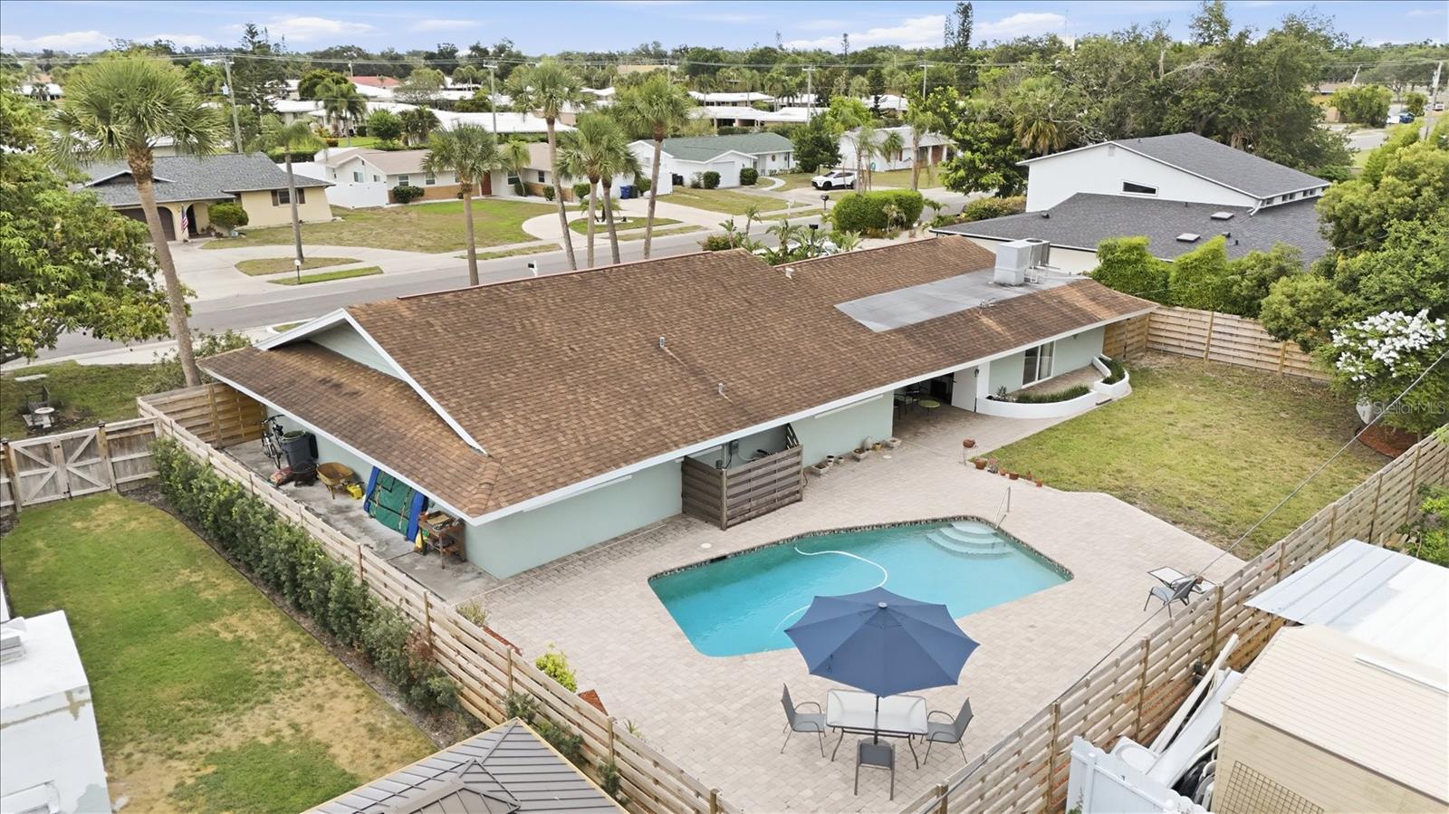 Beautiful 4BR/3Bath Pool Home in the highly desirable Southgate neighborhood close to everything great that Sarasota has to offer. Sitting on a perfect rectangular 10,500 Sq’ lot the home boast 2895 Sq’ of indoor livingspace, offering plenty of room for multi-generational living or converting the primary suite (with 2 doors to the exterior) into a Mother-In-Law apartment or ADU (AuxiliaryDwelling Unit) as a possible income generator. The stand-up attic offers excelent additional storage or oportunity to dormer and make into additional living space. When you enter the home, you are greeted by a massive living room and tastefully updated ceramic tile on the diagonal that carries throughout the home. The open plan main living areas are complemented with spacious split bedrooms for privacy. The light and bright kitchen has 2 windows and recessed LED lighting and ample stone counters that a cook or baker will appreciate, plus upscale Samsung black stainless steel appliances, and a breakfast bar to the bonus room that has 2 large pantry closets and a built in desk with shelves. French doors lead out to the paver brick; lanai, patio and sunny pool area, on a spacious fully fenced backyard. The home is on county water and sewer and has  9.5 year old roof, 2 zones of HVAC; one is 2021 14 SEER Trane 2 ton for the primary BR side of the home, and the other is a 13 year old 15 SEER 3.5 ton Comfortmaker that is serviced regularly for the rest of the home. Large overhanging roof provides shade for passive cooling and coverage for outdoor storage. Book your private showing and scoopup this great opportunity NOW!