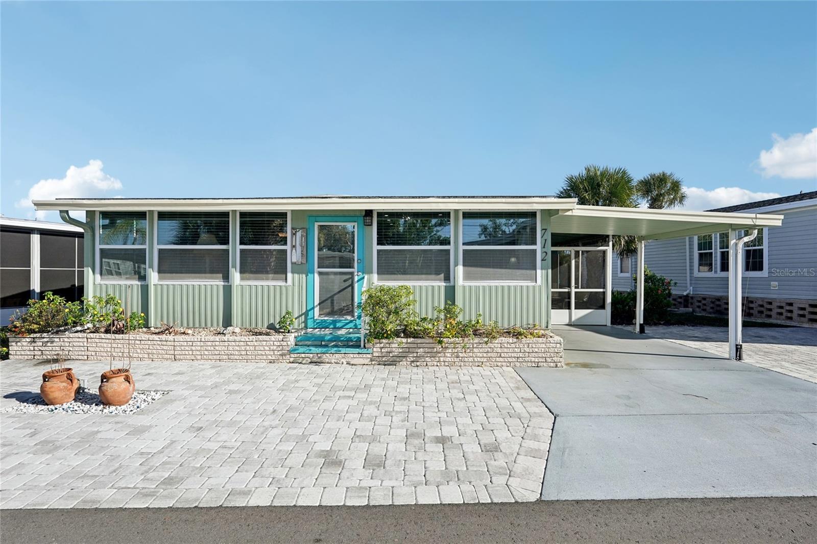 Welcome to Venice Isle, a beautiful resort-style community minutes to the beach (and NOT in a flood zone)! With multiple amenity centers, clubhouses, and pools, there is always something to do in this community! This home was completely remodeled, with over $120,000 in renovation costs, and is ready for its new owner! You'll know this home is special before even stepping inside, with tasteful pavers spanning the front of the home, adding plenty of extra parking space. There is a lovely screen lanai, with a storage room where you'll find the washer and dryer. Out back, there is a new shed, with extra straps for peace of mind during hurricanes, and a private backyard sitting area, perfect for entertaining! Inside, you'll find a nice open floor plan, with all of the living space flowing together into one great room. The former Florida room was converted to allow for additional living space, and the kitchen was remodeled with all new appliances, including a raised dishwasher (perfect so you don't have to bend down), and ice maker! Both bathrooms were completely remodeled, and the primary bathroom was converted from a half bathroom to a full bathroom! Both bedrooms have good sized closets, with a walk-in closet in the master bedroom. Throughout the home you'll find sheetrocked walls; new flooring with plywood subfloors; new plumbing and electric; and newly insulated walls and ceilings. All of the big ticket items have also been taken care of, with a new tankless hot water heater; new TPO roof; and new A/C vents and ductwork. Furnishings are negotiable. Venice Isle has two clubhouses and countless activities. You can stay as busy as you want, or stay to yourself; the choice is completely yours! Amenities include: heated pool, billiard room; shuffleboard; picnic area; horseshoes; putting green; fitness center; sauna; jacuzzi / spa; lawn bowling; and miniature golf. This is a great home in a great location; schedule your showing today! 

A full list of all of the upgrades can be found in the MLS attachments; just ask your agent to send you it!