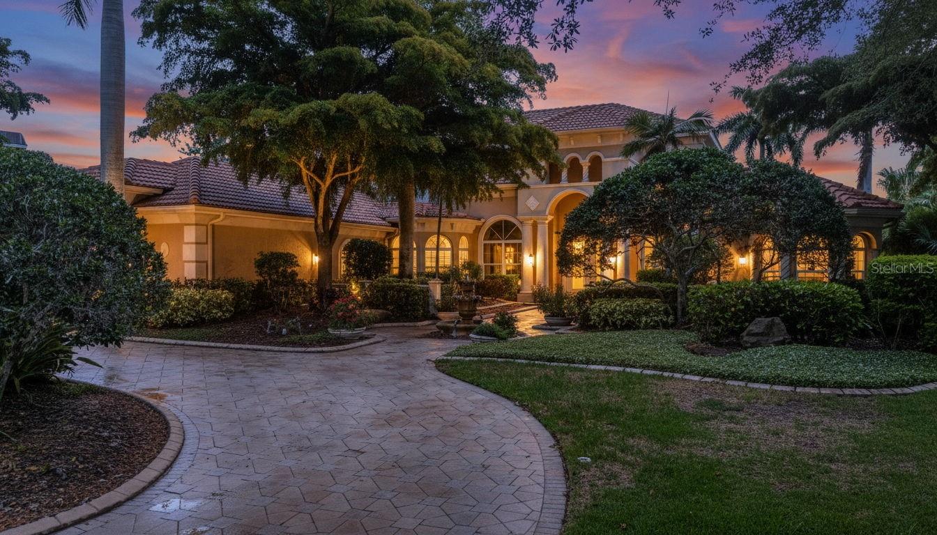 Nestled at the end of a quiet cul-de-sac within the exclusive Portmarnock enclave of Lakewood Ranch Country Club, this magnificent five-bedroom, five-bathroom estate offers an unparalleled living experience. Situated on an oversized lot, the property provides ultimate privacy as it abuts a tranquil preserve and overlooks the scenic 17th green of the Cypress Links course. A grand circular driveway leads to the four-car garage, while the home's exterior is protected by hurricane impact doors and windows for complete peace of mind. The home also features a new roof completed in 2023.

Inside, the residence impresses with soaring high ceilings, intricate tray and coffered details, and a striking chandelier that anchors the main living space. The split-bedroom floor plan ensures privacy for all, featuring a primary suite that boasts custom closet cabinetry and direct personal access to the pool area. In the media room, imported Brazilian wood floors add warmth and elegance, complemented by a convenient upstairs half-kitchen and a built-in whole-home speaker and security system.

The chef’s kitchen is a culinary masterpiece, featuring premium Monogram appliances, including an oversized refrigerator and an eight-burner gas oven with a griddle, all supported by a Kinetico reverse osmosis system. Transition seamlessly to the outdoors through pocket glass doors that open to a private upstairs oasis. The massive two-story lanai is an entertainer’s dream, housing a salt water pool, two cozy gas fireplaces, and a fully equipped outdoor kitchen and bar area with an integrated grill.

Living in Lakewood Ranch Country Club means accessing a lifestyle defined by world-class amenities. Residents may choose from various memberships to enjoy four championship golf courses, an aquatic and racket sports center, a state-of-the-art fitness facility, and multiple clubhouse dining options. As a premier master-planned community, this location puts you moments away from the finest shopping, dining, and recreation in the region. Come see why this spectacular home on the greens is the perfect place to enjoy a coveted Florida lifestyle.