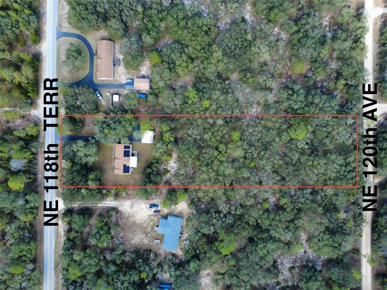 2.41 Acres on PAVED road! Meticulously clean 3/2 HOME. TAKE A LOOK---> NO HOA! Has PAVED driveway. Property is large enough to have an Additional Dwelling Unit (ADU) another home that can have its own entrance from the road on the backside. Reduce your electric bill...this home has Solar Panels!! and R50 insulation in ceiling.  12' x 16' She Shed is insulated, has electric and AC. This Skyline home has many upgrades such as Sheetrock Walls and Crown Molding throughout. Kitchen has Quartz Counters, Pantry, Farmhouse Kitchen Sink, NEW Stove & Refrigerator, lighting under the cabinets and ceramic tile backsplash. Living Room is spacious with vaulted ceiling. Enter the Beautiful Florida Room with its high ceiling and mini split to keep you comfortable all through the year. Primary Bedroom has walk-in Closet and a HUGE walk-in Shower with TWO separate showerheads and a Bench in the ensuite Bathroom. More storage space is in the Laundry Room, and it has a walk-in Pantry/Storage Closet. There is a detached metal carport-shed combo just out the side door. New HVAC in 2023.

So much space on this 2.41-acre lot for gardens, animals, firepit, swimming pool, workshop. This comfortable home & land is only 30 minutes from Gainesville. A 40-minute drive will take you to Cedar Key and the Gulf of America. Goethe State Forest is close by for Hiking, ATV riding, or Equestrian Pursuits. Williston is known for Scuba Diving in Blue Grotto or Devils Den.