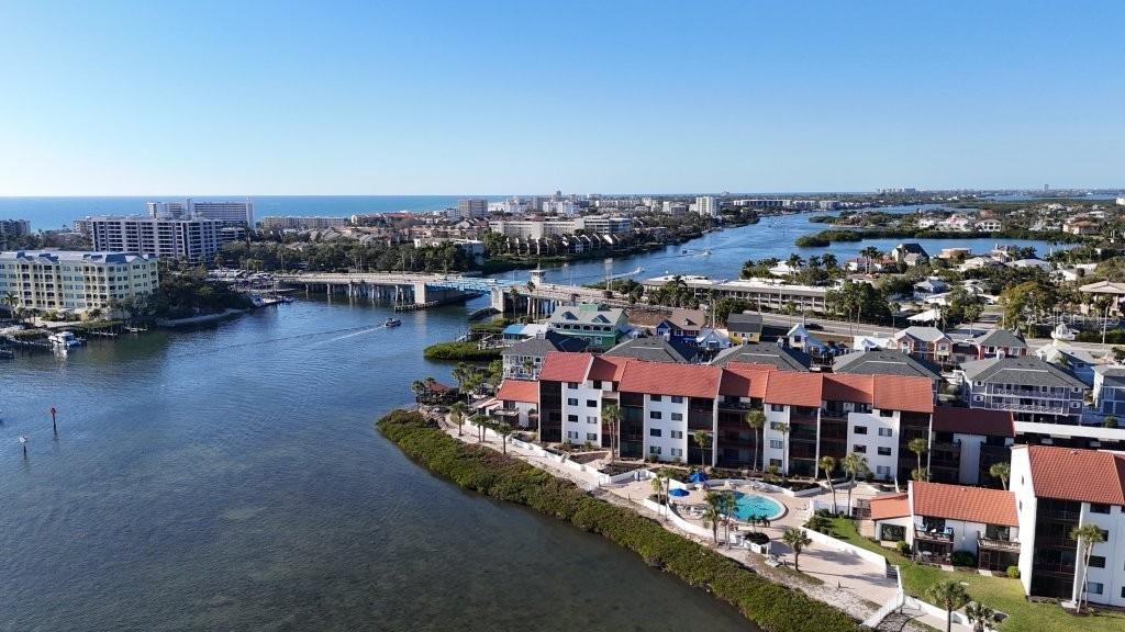 Nestled in the heart of Sarasota's coastal paradise, this beautifully renovated, TURNKEY FURNISHED waterfront condominium offers exceptional bay views and the effortless Florida lifestyle you've been searching for. Located in the highly sought-after Castel Del Mare, affectionately known as the "Hidden Jewel on the Bay," this beautifully updated first-floor 2-bedroom, 2-bath residence is less than one mile from Siesta Key Beach access and just minutes from downtown Sarasota, St. Armands Circle, premier dining, shopping, and entertainment. Step inside to discover a bright, inviting interior where tranquil water views immediately capture your attention. Thoughtfully renovated throughout, the residence showcases luxury vinyl plank flooring, a beautifully redesigned kitchen with shaker-style cabinetry, quartz countertops, tile backsplash, updated hardware and fixtures, generous workspace, and abundant storage. The spacious living and dining areas flow seamlessly to the private lanai, creating the perfect setting to relax while enjoying peaceful bay breezes and picturesque waterfront scenery. The generous primary suite offers beautiful water views, ample closet space, and a beautifully updated en-suite bath, while the guest bedroom and renovated second bath provide comfortable accommodations for family and visitors. Being offered completely turnkey furnished, this residence is ready to enjoy immediately as a full-time home, seasonal retreat, or investment opportunity. Beyond the residence, Castel Del Mare offers an exceptional collection of resort-style amenities, including two heated swimming pools, tennis and pickleball courts, shuffleboard, a clubhouse, kayak launch and storage, fishing, and a scenic waterfront boardwalk that winds throughout the beautifully landscaped community. Spend your days relaxing beside the bayfront pool, launching a kayak on the Intracoastal Waterway, watching dolphins and boats drift by, or taking in breathtaking Sarasota sunsets. With Siesta Key Beach just moments away and everything Sarasota has to offer within easy reach, this move-in ready waterfront retreat delivers an exceptional combination of location, lifestyle, and value. Schedule your private showing today and experience the best of Florida waterfront living.