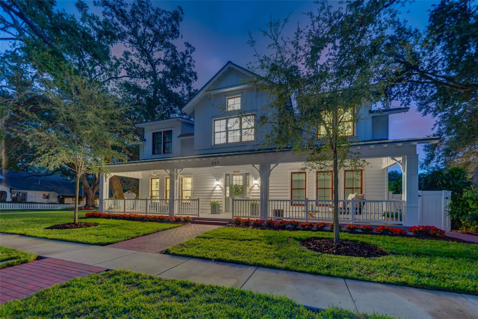 A truly masterful achievement of concept and design, this stunning designer ready custom 8,245 sqft residence built by Monogram builders showcases exquisite craftsmanship "3-miles of custom shiplap", classic elegance & cutting edge design. Meticulously maintained and landscaped - AstroTurf hardscaped backyard - this 13,774 sqft corner lot is located on one of Dunedin's brick streets - walkable to the downtown core of the community. Step into Timeless Elegance: 28' foot grand entry, engineered white oak wide plank hardwood floors, 20-foot 1/2 face brick natural gas fireplace, 7" baseboard molding & custom window treatments. The parlor offers peaceful solace from any busy day: board & batten, v-groove ceiling & chandelier. The great room, illuminated by natural light, features a "smart home" whole home interior & exterior audio powered by Savant, commercial-grade WiFi system, state-of-the-art security system fully extendible, built-in cabinets & mounted TV. Culinary kitchen: quartz top center island with farm sink, 3-pendant lights, Fishel & Paykel dishwasher, warming drawer, 3-pendant lights, 6-burner gas range, 2x ovens, range hood, brick backsplash, barn door walk-in pantry. French doors open to the family sunroom overlooking the private fenced backyard with pool powered by a heat pump (warm in the winters cool in the summers). This home is an entertainers delight and can easily accommodate upwards of 200 people! Butler pantry: granite top, sink, ice maker, walk-in pantry. Sumptuous first floor owner's retreat: beamed ceilings, shiplap, 2 decorator chandeliers, his/her sizeable custom master closet, desk. 8' frosted glass French doors open into the master bathroom: 2-quartz top vanities, built-in linen closets, glass door walk-in steam shower, rainfall & double shower heads, separate water closet. Access to sun porch. Laundry room. Kids game & crafts room ideal for a playroom + storage & art room. Powder room. Second floor features an in-home theater: cathedral ceilings, screen & projector, wet bar. An in home office: exposed ductwork, wet bar, ice maker & mini frig, cabinet storage, room for a pool table, TV, adjacent fitness room, both are soundproof. Each 4-bedrooms: walk-in custom closets, ceiling fans, hardwood floors, 7" baseboard molding. Side-load 3-car garage with anti-slip flooring, 7k lb car lift totaling 4-car garage extendable to a 6-car garage. Whether its by sheer happenstance or smart business design, Dunedin located on the Intracoastal Waterway of the Gulf of Mexico has succeeded in maintaining its small-town charm while putting out the welcome mat for visitors. Its walkable Main Street has unique restaurants, interspersed with boutiques and an abundance of craft breweries. Minutes to the Tampa International Airport rated No. 1 and the Gulf Beaches.