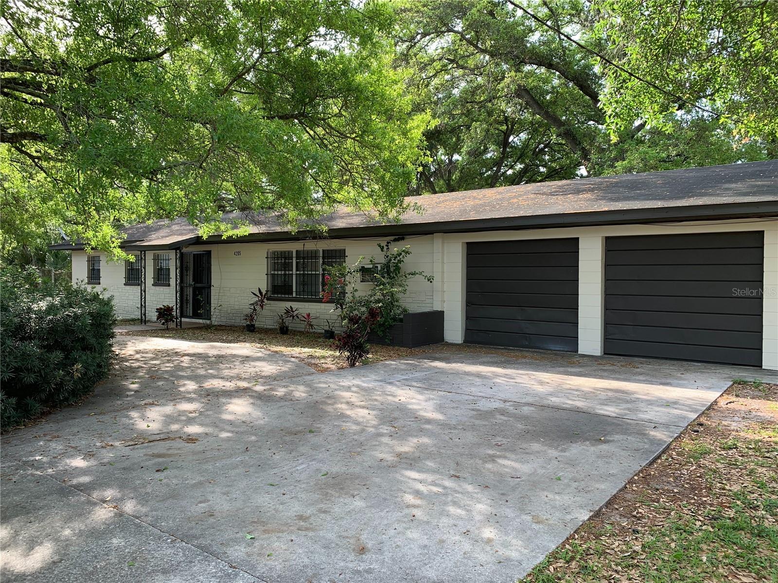 This CI-zoned parcel presents a valuable opportunity in central Tampa, encompassing approximately 17,760 square feet of land suitable for diverse redevelopment projects. Located just east of the Ybor City corridor and minutes from downtown, the property benefits from its ultra convenient access. The site comprises three lots, offering optimal flexibility for business professionals, entrepreneurs, or investors. Commercial Intensive zoning supports multiple commercial activities and a broad range of service uses. Currently, the property includes a three-bedroom, two-bath block home with a spacious two-car garage, making it conducive to live-work arrangements and further enhancing its versatility.