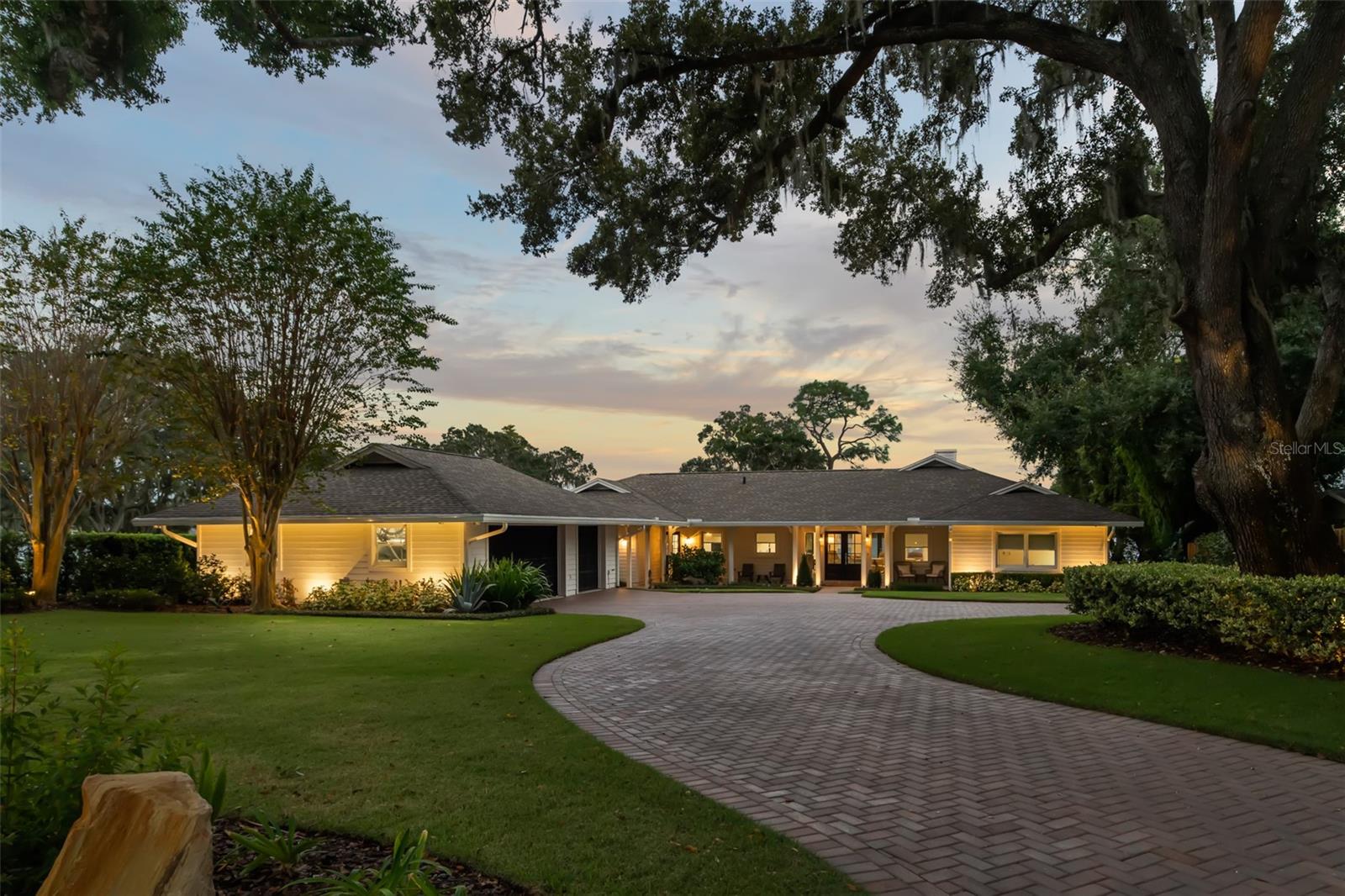 Welcome home to your recently remodeled lakefront oasis located on approximately 119’ of waterfront on the shores of Lake Minnehaha on the Winter Park Chain of Lakes. Everything you have been looking for is finally here. In late 2021, this home went through an extensive renovation from the ground up, the entire interior was completely gutted with all new drywall, electric, plumbing, lighting new 3 zone AC, home automation and so much more. Tucked away off a quiet street, this home features incredible panoramic views of the lake, meticulous landscaping and large oaks that create a canopy-like entrance. Entering the house, you immediately take in the picturesque views of Lake Minnehaha- the views from the living room and kitchen are simply incredible. The interior layout was thoughtfully changed to make the spaces open and grand. The completely brand-new kitchen has custom cabinets and all new appliances, as well as a butler’s pantry that features an ice maker and plenty of room for all the extra appliances. The Calcutta gold quartz counter tops accent the solid wood cabinets and the amount of light that comes in the home is simply stunning. The redesigned master bedroom and bath has everything you need, including sliding doors that lead out to the deck and salt water pool that was put in late 2022. On the opposite side of the home, you will find two nicely appointed bedrooms that share a brand new bathroom. The den/office is the perfect spot to kick back and enjoy views of the backyard. As you walk outside to your large screened-in back porch, you will notice how quiet and serene this location really is. The new heated salt water pool is elevated and provides a great spot to hang out with family and friends. When it’s time to get out on the boat, simply walk down your private path to your very own boat dock. If taking out the jet ski is more your thing, simply hop on and cruise the 6 lakes that make up the Winter Park Chain of lakes. With landscape lighting throughout, this property is unique and will be hard to replicate. If you need garage space this has it too- with 3 air conditioned spaces you will have plenty of space to park your toys. Current owner has drawings to recreate the garage and have space above that can be additional bedrooms or home gym - providing an additional 1500+ square feet of living space. Home is zoned for A-rated public schools, and you are just minutes from award-winning restaurants and boutique shops along Winter Park’s famed Park Avenue, the Racquet Club and Interlachen Golf & Country Club.