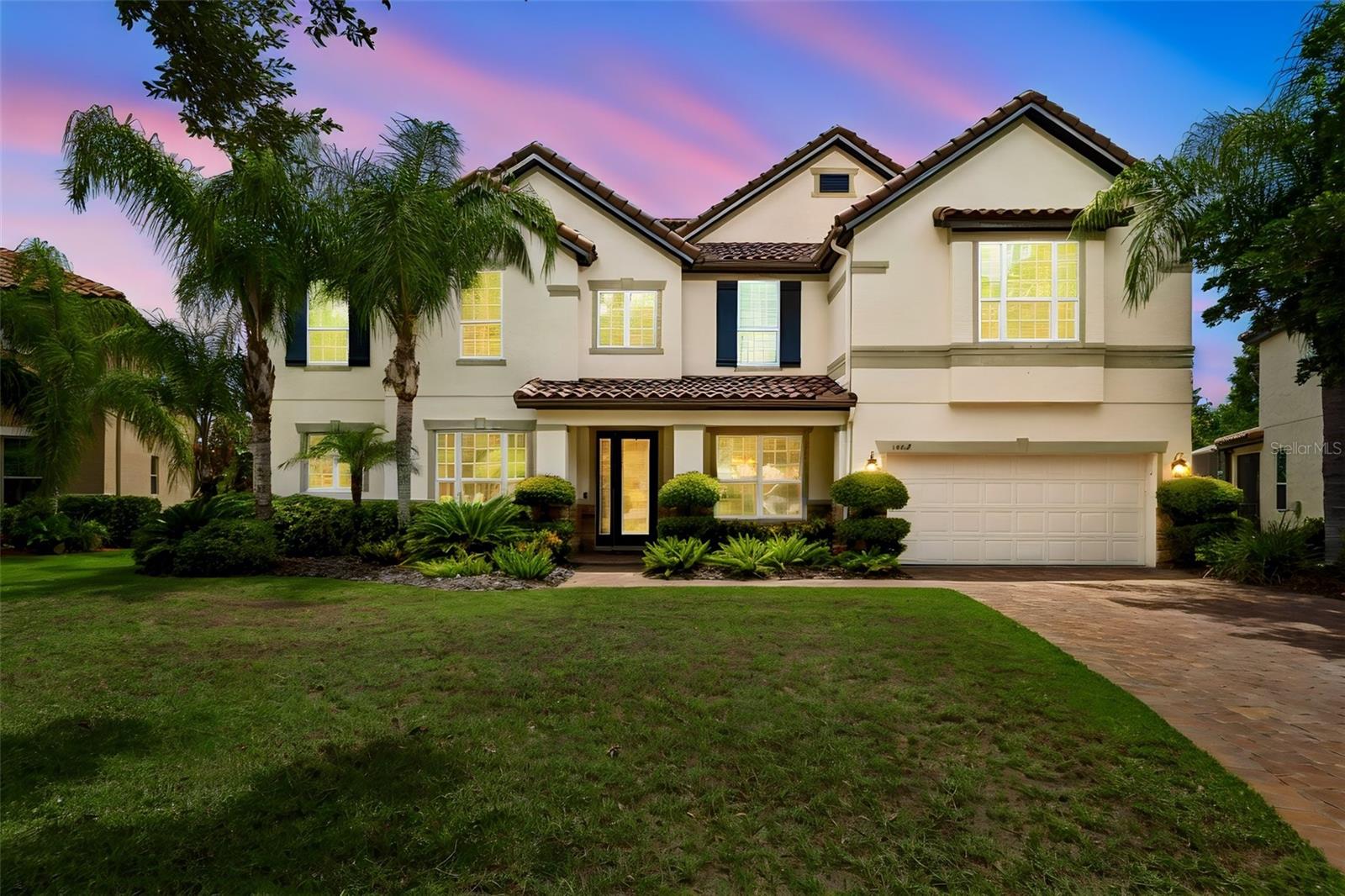 Virtually Staged. Spectacular Lake Byrd Luxury Estate | 7BR | 4BA | Office | Bonus Room | Media Room | Two Primary Suites | Pool | 3-Car Garage | Gated Bella Casa.
Experience luxury lakefront living in this extraordinary executive residence, perfectly situated on a quiet cul-de-sac within the private gated community of Bella Casa. Offering over 5,200± square feet, this exceptional 7-bedroom, 4-bathroom home showcases breathtaking views of Lake Byrd, an expansive and private homesite, lake access, resort-style outdoor living, and an incredibly versatile floor plan ideal for multigenerational living.
From the moment you arrive, you'll appreciate the beautifully paved and professionally sealed driveway and walkways leading to an impressive entrance featuring soaring ceilings, an executive office, formal dining room, and an additional flex/living space. Rich wood flooring flows throughout the main living areas and is complemented by extensive crown molding, abundant storage, plantation shutters, and natural light that fills the home.
Designed for effortless entertaining, the open-concept family room and gourmet kitchen capture spectacular views of the pool, pavered lanai, expansive backyard, and tranquil waters of Lake Byrd. Hunter Douglas motorized blinds enhance both comfort and convenience in the living area, while the chef's kitchen features double built-in ovens, abundant counter space, an oversized island with seating, and a butler's pantry. The first-floor owner's retreat serves as a luxurious private sanctuary with beautiful lake views, an en-suite bathroom, and a custom-designed walk-in closet. A second first-floor bedroom and full pool bath provide exceptional flexibility for guests or extended family.
Upstairs, an expansive bonus room with wet bar becomes the perfect gathering space while overlooking the lake. A second luxurious primary suite offers an ideal multigenerational living option, complete with beautiful lake views, an oversized walk-in closet, and a beautifully appointed en-suite bath. Four additional spacious bedrooms—all featuring walk-in closets—provide abundant accommodations, while a dedicated media/flex room offers endless possibilities as a theater, golf simulator, fitness studio, game room, or creative space. An additional full bath and extensive storage complete the upper level. 
Outdoor living is equally impressive. The screened lanai overlooks a sparkling Pebble-Tec pool with electric heater, beautifully sealed paver deck, covered entertaining area, propane fire pit, and an amazing backyard. Whether hosting family gatherings or enjoying peaceful evenings overlooking the lake, this outdoor setting delivers the Florida lifestyle at its finest.
Additional premium features include a spacious three-car garage, two HVAC systems, hurricane protection panels, durable cement barrel tile roof, extensive storage throughout, and thoughtful upgrades that reflect pride of ownership.
Bella Casa is an intimate gated community offering privacy while remaining conveniently located near highly rated schools, golf courses, upscale shopping, restaurants, parks, medical facilities, and major commuter routes throughout the Tampa Bay area.
Luxury, privacy, flexibility, and exceptional lakefront living converge in this remarkable residence. Please explore the attached 3D tour, floor plans, video, and dedicated property website for a complete interactive experience. Easy to show and ready to impress.
