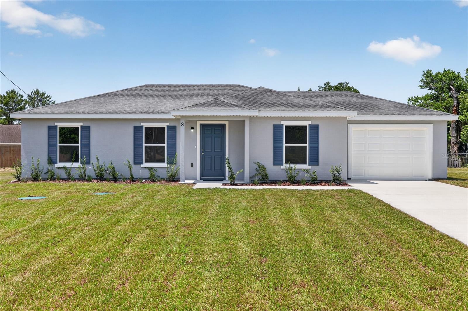 NEW, NEW, NEW!  New Construction! New ENHANCED FLOOR PLAN! New REIMAGINED FEATURES! This home blends a timeless design with modern living.  From the moment you walk through the front door you will feel the openness with the cathedral ceiling in the foyer, living room, and dining room!  Durable ceramic tile flooring flows seamlessly throughout the home. The kitchen boasts stainless steel appliances, sleek quartz countertops, ample cabinetry, breakfast bar and a spacious pantry.  Do laundry with ease in the air-conditioned laundry room. The bedrooms have all been expanded to maximize living space. An impressive, attached garage provides convenience and ample storage.  This home rests on just under a 1/4 acre lot ~ enough room for the family & pets to play, but not too much yard work.  Silver Springs Shores offers easy access to restaurants, shops, healthcare facilities, art galleries and local events, plus outdoor recreation opportunities like parks, lakes, biking, swimming, hiking, kayaking and much more.  The Builder is including a 1 year full warranty and a 2-10 home warranty!   Any dimensions listed are approximate.  Photos/Virtual Tour are to show interior and exterior colors and finishes and may or may not be of this actual listing.  Garage orientation and floor plan may vary for actual home. BUILDER WILL PAY UP TO $4000.00 TOWARDS BUYERS CLOSING COSTS WITH FULL PRICE OFFER!