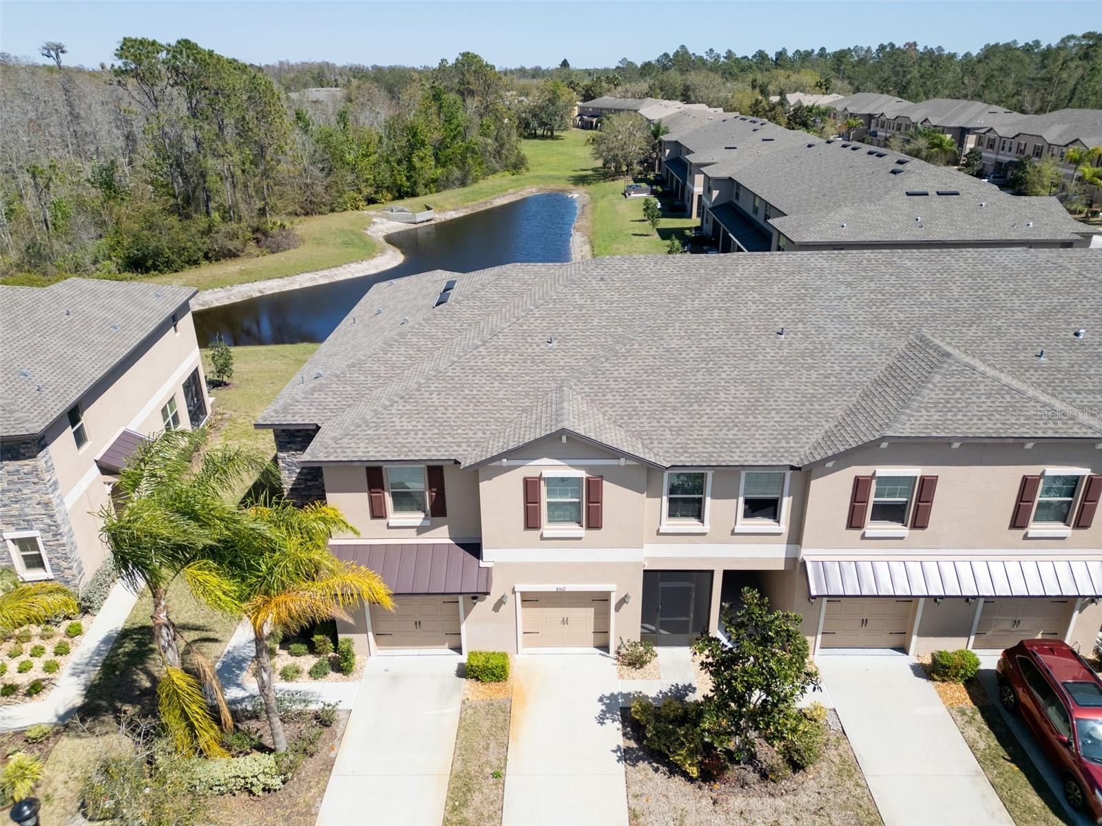 Welcome to 8512 Reidville Street, a beautifully maintained Lennar townhome located in the highly desirable Water's Edge community of New Port Richey. Lightly lived in and meticulously cared for as a second home, this move-in ready residence offers the perfect combination of comfort, convenience, and low-maintenance living.
Featuring 3 spacious bedrooms, 2.5 bathrooms, and a one-car garage, this home boasts an open-concept floor plan designed for both everyday living and entertaining. The kitchen overlooks the living and dining areas and offers ample cabinetry, generous counter space, and modern appliances, creating a functional and inviting gathering space.
Sliding glass doors lead to a private rear patio overlooking a tranquil pond, providing the perfect setting to enjoy your morning coffee or unwind after a long day while taking in the peaceful water view.
Upstairs, the primary suite provides a relaxing retreat with a private en-suite bath and walk-in closet. Two additional bedrooms provide flexibility for family, guests, or a home office, while the conveniently located second-floor laundry room adds everyday convenience.
Ideally situated directly across from the community pool, residents can enjoy resort-style amenities just steps from their front door. Whether you're looking for a full-time residence, seasonal retreat, or investment opportunity, you'll appreciate the pride of ownership throughout this barely lived-in home.
Water's Edge offers a beautifully maintained community atmosphere with convenient access to shopping, dining, medical facilities, and entertainment. Outdoor enthusiasts will love being just minutes from Weeki Wachee Springs, Gulf Coast beaches, parks, and nature preserves. Commuters benefit from quick access to the Suncoast Parkway, providing an easy drive to Tampa, Tampa International Airport, and surrounding areas.
Don't miss your opportunity to own this exceptional townhome with pond views and community amenities in one of New Port Richey's most convenient locations. Schedule your private showing today!