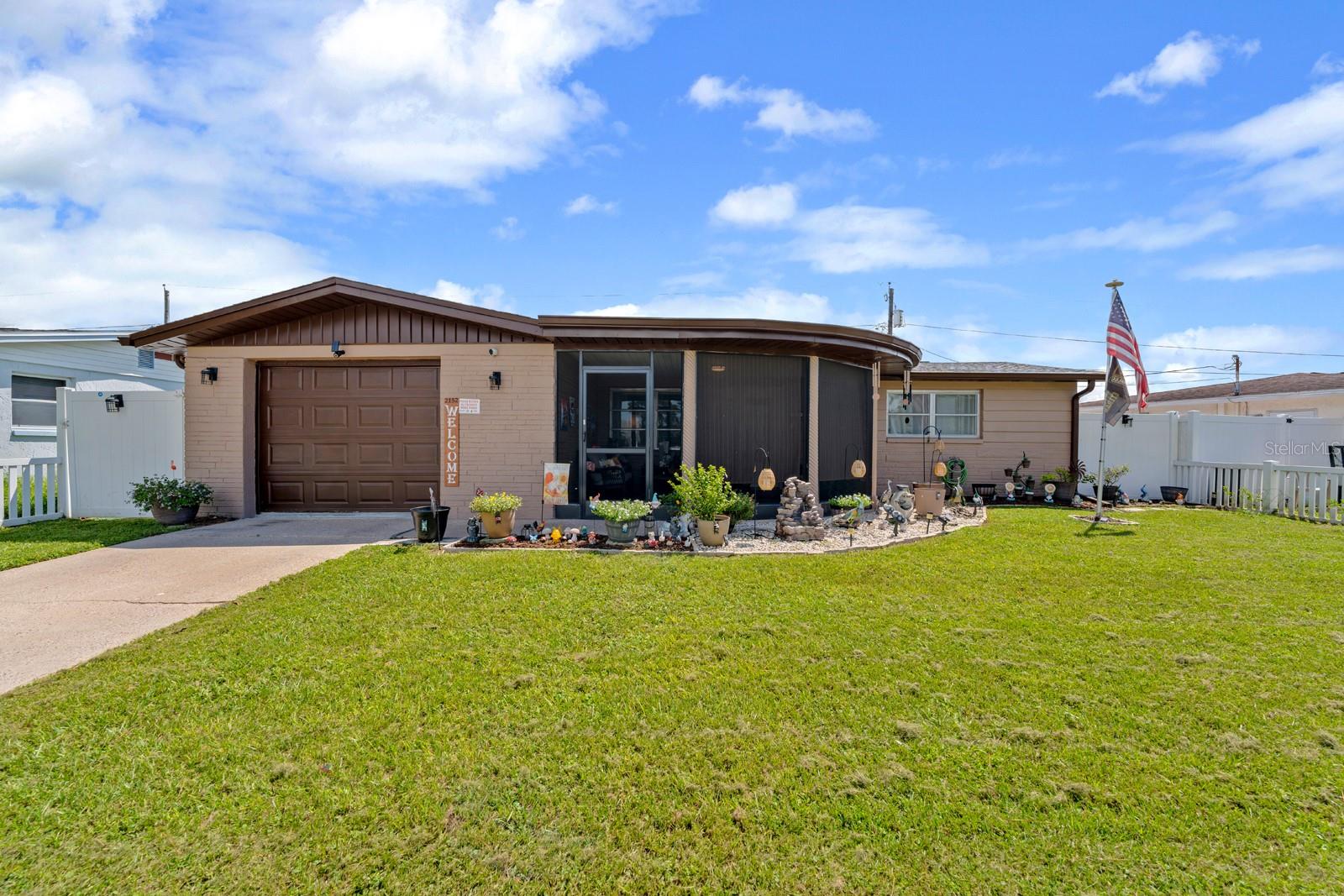 Welcome to this beautifully updated 3-bedroom, 2-bathroom home located in Holiday, FL, just minutes from gulf beaches, Anclote fishing pier,
and Historic Tarpon Springs Sponge docks. This house sits on Arcadia Road in a fantastic location that puts you close to waterfront activities and coastal attractions. Step inside to discover an open floor plan with gorgeous gray wood plank flooring throughout the main living areas. The chef's kitchen features white shaker cabinets, granite countertops, stainless steel appliances, LED recessed lighting, and a stylish tile backsplash. Both bathrooms have been thoughtfully updated with new vanities, 18x18 porcelain tiles, and elegant marble vanity tops. The primary bathroom received a complete professional remodel with a modern shower featuring full-length quartz stonework. Recent improvements include a newer roof installed in 2022, new ceiling fans and light fixtures throughout, plus 5.5-inch baseboards and new 6-panel doors with updated hardware. Fresh neutral paint brightens the interior while a beautiful new exterior color enhances curb appeal. Outside, you'll love the new screen-enclosed front porch and fresh landscaping with new plants and mulch. The backyard offers complete privacy with white vinyl fencing. New window treatments complete the move-in ready feel of this home. This property combines modern updates with comfortable living in an unbeatable location. You're just moments away from Florida's beautiful gulf coast while enjoying all the comforts of a renovated home and NO FLOOD ZONE!