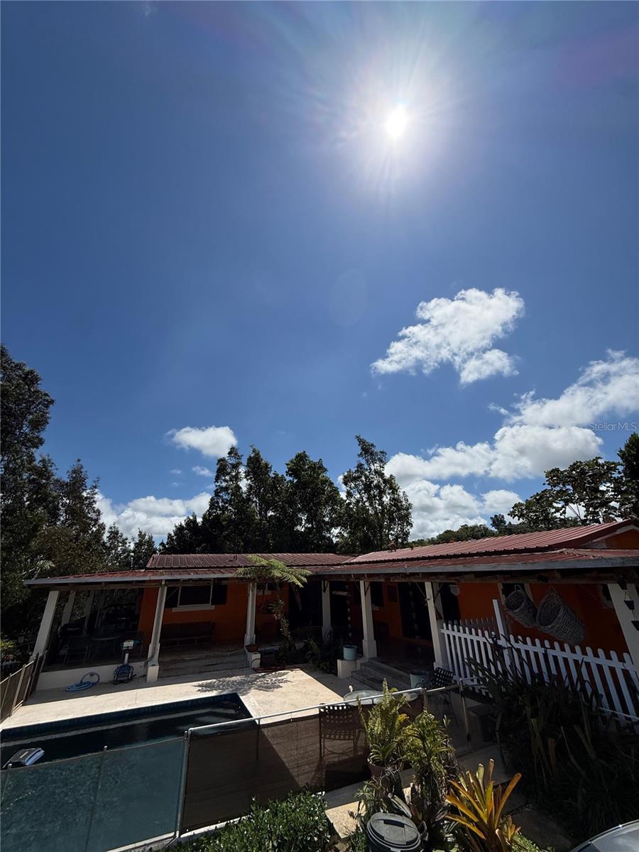 Escape the noise without sacrificing convenience. Nestled in the mountains of Bayamón’s Nuevo Ward, this unique estate sits on nearly 4 acres of land and offers the perfect balance between countryside tranquility and city accessibility—just approximately 30 minutes from Guaynabo.

Featuring 2,028 square feet of living space, 3 bedrooms, 3 bathrooms, a swimming pool, covered terrace, storage areas, and expansive outdoor spaces, this property is designed for those who value privacy, nature, and room to grow.

The home’s open-concept layout seamlessly connects indoor and outdoor living, creating an ideal setting for entertaining, family gatherings, retreats, and special events. The generous lot provides endless possibilities, whether you’re dreaming of a private family estate, hobby farm, weekend getaway, or income-producing investment property.

With its peaceful mountain setting, ample parking, and resort-style atmosphere, this property also presents an excellent opportunity for short-term rental income, Airbnb hosting, wellness retreats, corporate escapes, or intimate event experiences.

Wake up to mountain views, enjoy the serenity of rural living, and still be within easy reach of Guaynabo, Bayamón, shopping centers, restaurants, schools, and major highways.

A rare opportunity to own a private mountain retreat with exceptional potential, space, and lifestyle appeal.

Offered at $400,000.
