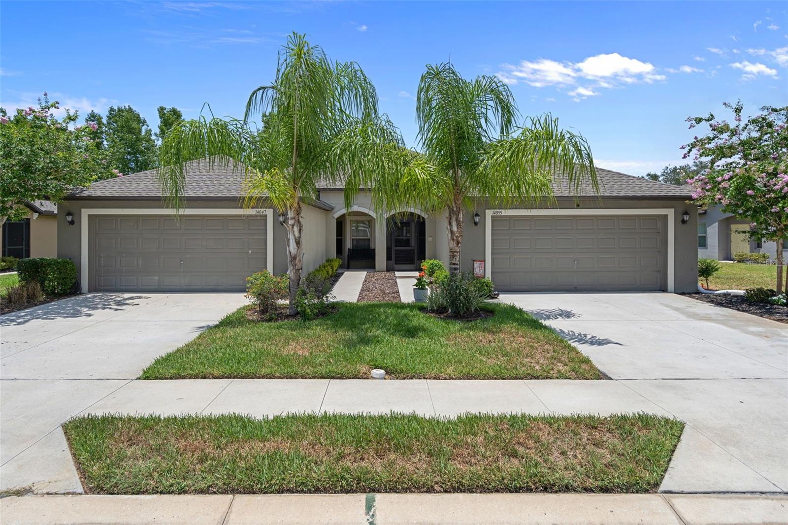 Welcome to this bright and beautifully kept 3-bedroom, 2-bath villa offering spacious living and tranquil pond views. Step through the screened front entry to find a handy laundry room with extra cabinetry, plus direct access to the attached 2-car garage with custom epoxy floors and a filtered water softener. The open-concept layout boasts soaring ceilings and abundant natural light. The kitchen, perfect for both daily life and entertaining, features stainless steel appliances, extra cabinetry, a breakfast nook, and bar seating, flowing seamlessly into the dining and living areas. The secondary bedrooms provide generous closet space and easy access to a full guest bath with a tub/shower combo. Privately tucked off the living room, the roomy primary suite includes a large walk-in closet and an en-suite bath with dual vanities and an oversized walk-in shower. Through the barn doors, relax on the screened lanai overlooking the peaceful pond—ideal for morning coffee, evening cocktails, or serene sunsets. Additional touches include laminate wood flooring in all bedrooms and ceramic tile throughout the main living spaces. The low-maintenance lifestyle is made easy by an HOA covering lawn care, trash, roof upkeep, and exterior painting. Enjoy community amenities like a clubhouse with fitness center, playground, basketball, walking trails, tennis courts, and pool. This low maintenance home is ready for you today!