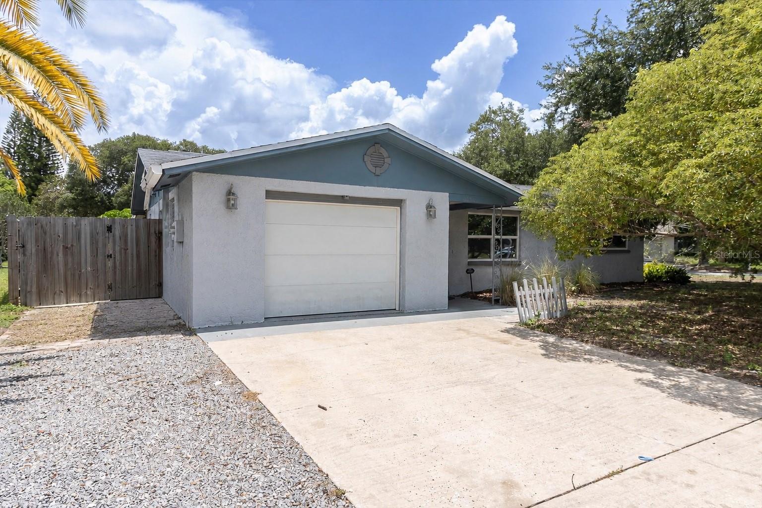 Virtually Staged. Welcome to 5228 Greenwood St in New Port Richey — a 2-bedroom, 2 full bath pool home with 1,324 square feet of living space, situated on an oversized corner lot in a quiet cul-de-sac setting. With no HOA and no flood zone, this property offers flexibility, privacy, and peace of mind in a convenient location close to downtown New Port Richey and just minutes from world-class Gulf beaches.

Inside, the home features a freshly painted neutral interior, vinyl plank flooring, double-pane windows, and a light, inviting layout ready for the next owner. All major appliances are included, with a washer that is approximately two years old and a dishwasher that is approximately three years old. A Ring doorbell adds an extra touch of convenience.

The oversized yard provides plenty of room to enjoy the Florida lifestyle and offers great potential for boat parking, extra outdoor storage, gardening, pets, or creating your own private backyard retreat. The 6-foot privacy fence adds to the usable outdoor space, while the private pool area is a major highlight with a pool pump that is approximately one year old and a pool liner replaced about two months ago.

Additional updates include a 2015 roof, 2020 AC that was recently serviced, a water softener that is approximately two years old, and a water heater that is approximately three years old. A survey is also available confirming/permitting the fence.

With its cul-de-sac location, oversized corner lot, private pool, no HOA, no flood zone, room for boat parking, close proximity to downtown New Port Richey, and easy access to Gulf beaches, this home offers a strong combination of location, lifestyle, and value.  

Finding a pool home at this price and an oversized lot is a rarity that won't last long!  Schedule your showing today!