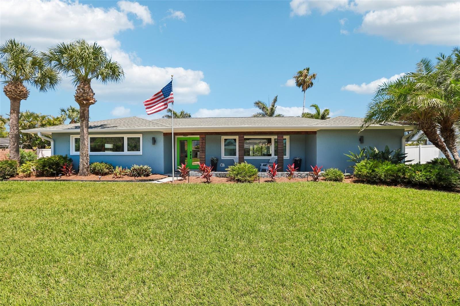 Welcome to the heart of Belleair Beach, a coastal community where life moves at a slower, more intentional pace. Perfectly positioned just moments from the sugar-white sands and Gulf-front sunsets that define Belleair Beach, this beautifully renovated pool home delivers the kind of lifestyle people move here for. As you arrive, the curb appeal immediately stands out, with fresh landscaping framing the exterior and setting the tone for what’s inside. Offering 4 bedrooms, 3 full bathrooms, and over 2,100 square feet of interior living space, this home sits on an oversized lot just under one-third of an acre, giving you the space that’s often hard to find this close to the beach. Step through the glass double front doors and you’re welcomed by wood-look tile flooring that flows throughout a light-filled interior. The layout is both functional and inviting, with the front living room seamlessly connected to the dining area just off the kitchen, creating an easy flow for everyday living and entertaining. Oversized sliding glass doors frame a beautiful view of the pool, bringing the outdoors in. The owner’s suite is a true retreat, featuring its own set of sliding glass doors leading directly to the pool area, creating the perfect way to start your mornings. The owners ensuite bathroom features designer tile flooring, dual vanities, and a seamless glass-enclosed shower with floor-to-ceiling tilework. The kitchen has been completely renovated with a modern design that feels both elevated and functional, showcasing rich espresso cabinetry, quartz countertops, a designer backsplash, and Bosch stainless steel appliances, including a sleek vent hood. Just off the kitchen, the family room offers additional living space with direct access to the lanai and leads into the private bedroom wing. This split floorplan provides flexibility and privacy, with two bedrooms connected by a Jack and Jill bathroom, while the third bedroom features its own sliding glass doors to the lanai. The third full bathroom has its own pool access, and is beautifully updated with a black-framed glass shower and stunning tilework. Step outside to a screened-in lanai designed for true Florida living, complete with a large inground pool surrounded by travertine tile and a covered patio accented by a warm wood ceiling detail. The backyard is expansive and fully fenced, with lush landscaping, generous green space, and a pathway leading to a dedicated firepit area, creating multiple spaces to relax or entertain. Beyond the home, the location continues to deliver with a short stroll to the beach and the Belleair Beach Marina right down the road. Boating, fishing, paddleboarding, or kayaking along the Intracoastal is right at your fingertips. Golf lovers will enjoy a short drive to both the Belleair Country Club and Pelican Golf Club, known for their beautifully maintained courses and upscale coastal atmosphere. Just minutes away, you’ll find the waterfront dining and coastal charm of Belleair Bluffs, along with local boutiques and everyday conveniences. With easy access to Clearwater and St. Petersburg, you’re never far from top-rated dining, shopping, and entertainment. Whether it’s a sunset walk on the beach, a day out on the water, or a casual dinner overlooking the coast, this location offers the perfect balance of everyday convenience and peaceful coastal living. This is where Florida lifestyle meets space, style, and a setting that truly feels like a hidden gem.