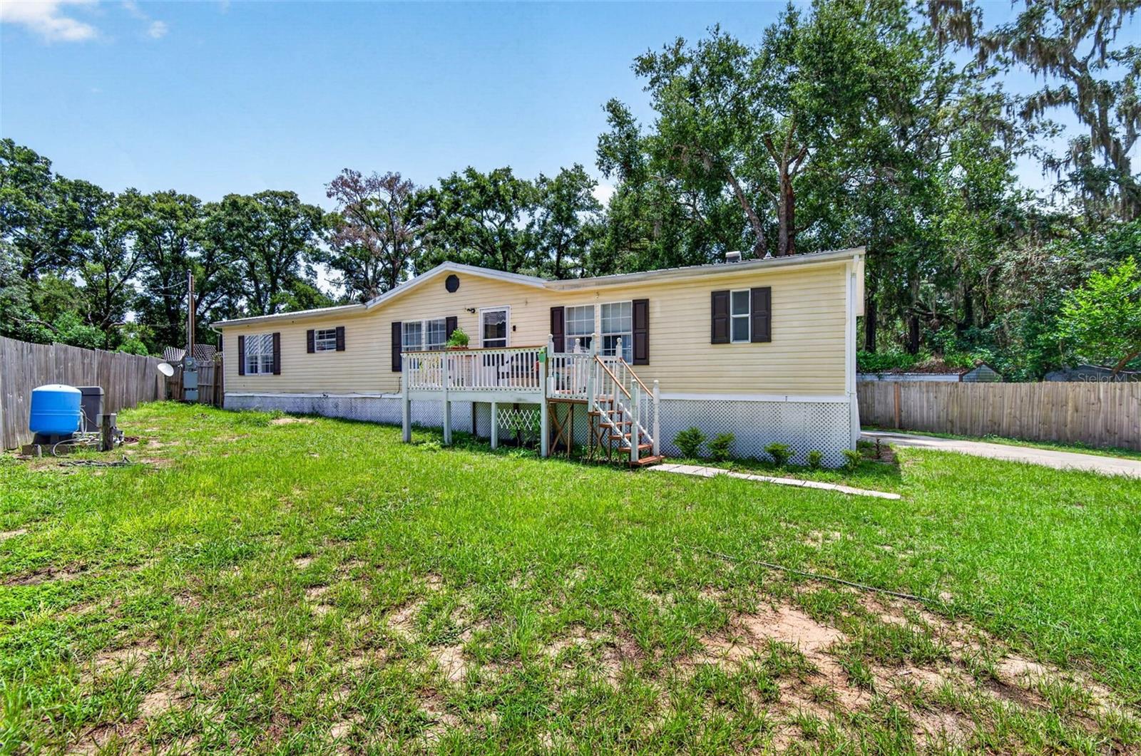 Welcome to 12641 Idlewood Dr! This updated 3-bedroom, 2.5-bath home offers 1,848 square feet of comfortable living space in the heart of Thonotosassa.

Inside, you'll find vinyl flooring throughout, a beautifully updated kitchen with newer countertops, refrigerator, range, and dishwasher, and a spacious living room with a cozy fireplace. The primary suite features a private ensuite with a separate soaking tub, while the functional layout offers plenty of space for everyday living.

Step outside to enjoy the fully fenced backyard, complete with an above-ground pool and a spacious deck—perfect for entertaining, relaxing, or soaking up the Florida sunshine. The home also includes a garage, indoor laundry, and central heating and air.

Move-in ready with great indoor and outdoor living spaces, this home is one you won't want to miss. Schedule your private showing today!