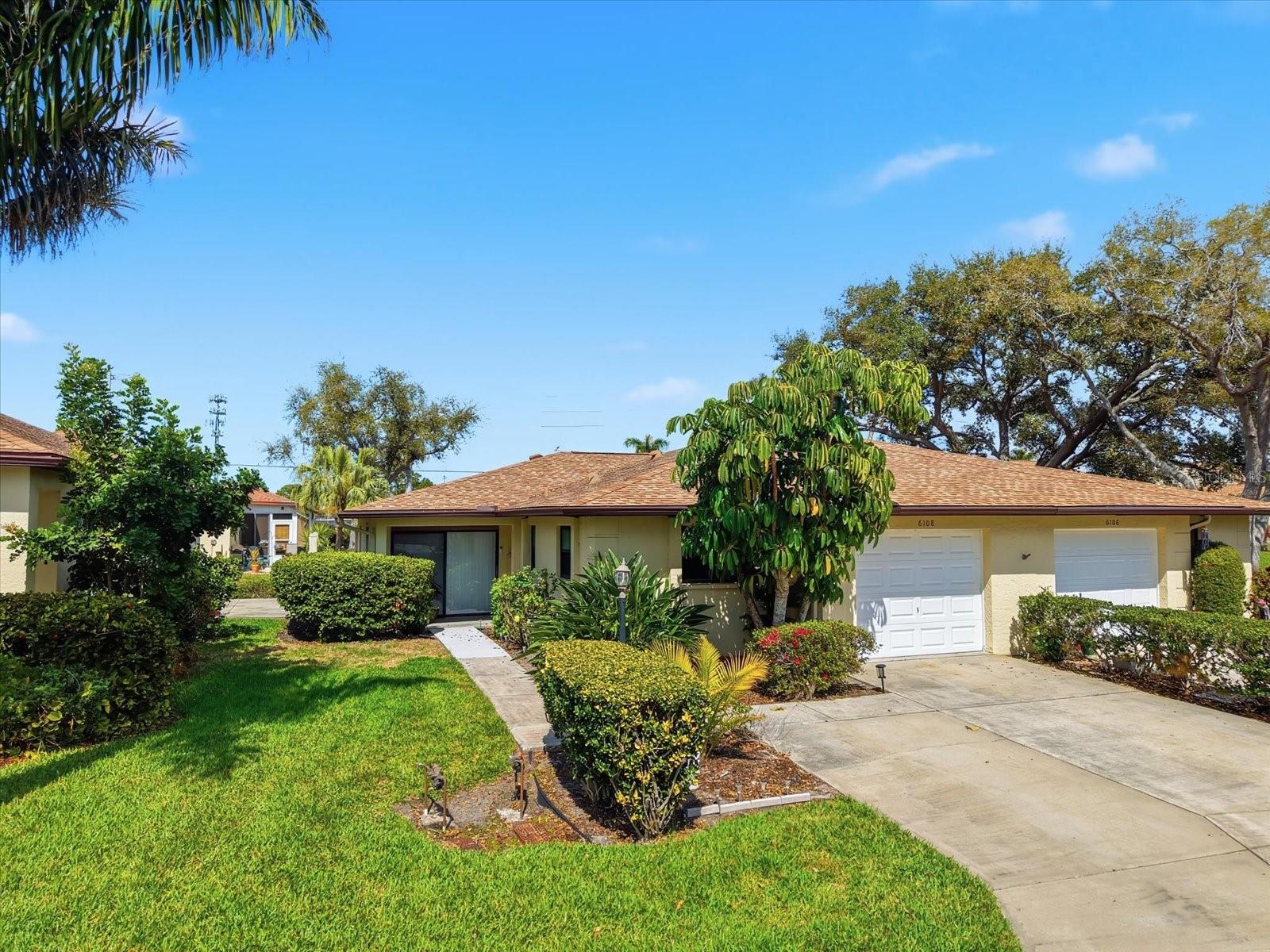 Spacious pet-friendly villa with garage, oversized driveway parking, and hurricane impact windows in a desirable non-age-restricted Bradenton community just minutes from IMG Academy, SRQ Airport, and the beautiful beaches of Anna Maria Island. Located in a no-flood zone on a quiet cul-de-sac, this well-maintained 2-bedroom, 2-bath home offers easy, maintenance-free Florida living ideal for seasonal or full-time residents. Inside, you’ll find a bright and functional layout with spacious living and dining areas, generously sized bedrooms, and abundant natural light throughout. The condo association maintains the roof, which was replaced approximately 4 years ago, and the home also features newer gutters and downspouts plus hurricane impact windows with a lifetime warranty for added peace of mind. A rare extended driveway provides parking for up to four vehicles in addition to the 1-car garage. Furnishings are negotiable, making this an affordable Florida getaway and an excellent opportunity to move right in or personalize over time. Residents enjoy a community pool just steps away along with a convenient location near restaurants, shopping, golf, fishing, kayaking, live music, and fresh seafood dining. Downtown Sarasota, Gulf Coast beaches, and everyday conveniences are all just a short drive away. Great opportunity to own an affordable Florida retreat in a highly convenient West Bradenton location.