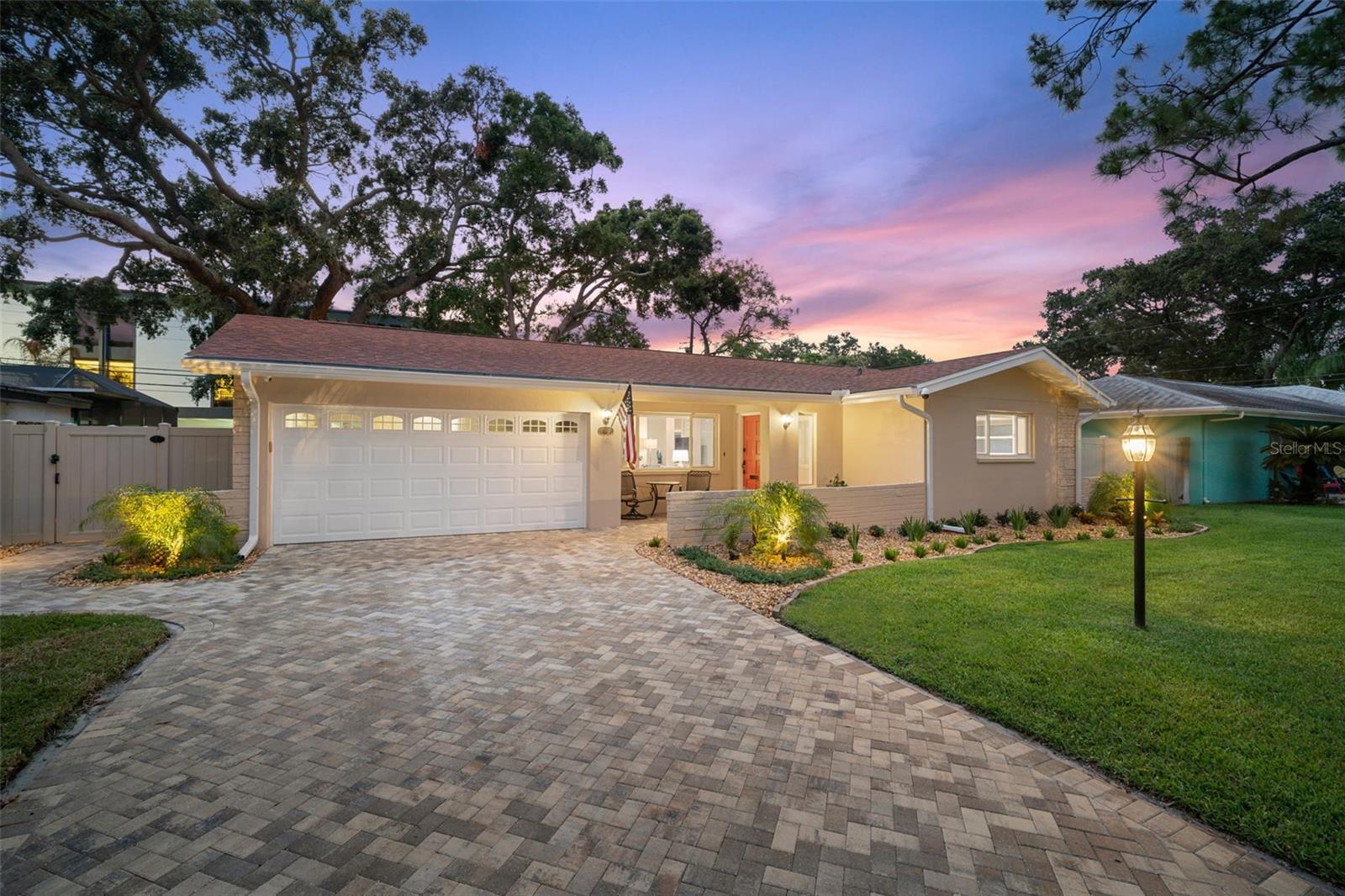An unfurnished home—once a 5-star Airbnb Guest Favorite and beautifully maintained—rests on a peaceful, tree-lined cul-de-sac in highly desirable Riviera Bay, just 3 minutes from Target, Publix, shops, and restaurants. This 3-bedroom, 2-bath home offers 1,400 sq. ft. of bright living space centered around a designer kitchen with quartz countertops, under-cabinet lighting, and upgraded appliances. Porcelain wood-look flooring and energy-efficient windows with light-filtering/blackout and Roman shades enhance the home's comfort and style. Modern smart-home features include a 5.1 surround sound system, app-controlled locks, switches, and security cameras. The spacious lanai, with porcelain flooring and sliding vinyl windows, expands the living space, while a dedicated bonus room offers flexibility for a home office or hobbies. Relax or entertain in a fully fenced backyard with ambient lighting, outdoor speakers, mature landscaping, paver patio and walkways. Reclaimed water helps maintain the lawn, and a security system with optional monitoring provides local alerts. The insulated one-car garage includes EV charger, epoxy flooring, storage, and a new washer/dryer just inside the kitchen entry. Available the first week of September at $3,500/month with landscape maintenance, fertilizing, grub control, and termite/pest control included. Tenants are responsible for utilities. $50 non-refundable application per adult. Pets are welcome with owner approval. This is a non-smoking home.