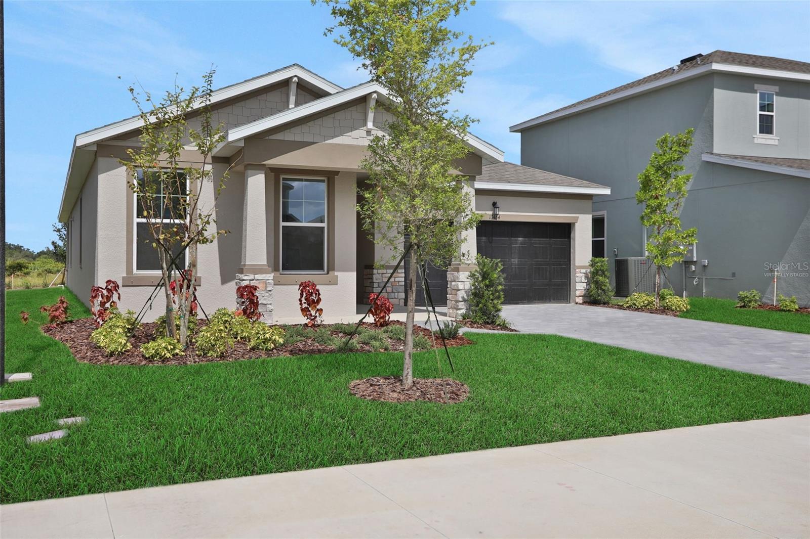Virtually Staged. Under Construction. Spacious 4-bedroom, 2.5-Bath home located in Punta Gorda’s newest resort-style, low-maintenance community, Turnleaf. This open- concept home features a modern kitchen with white shaker-style cabinetry and white quartz countertops, complemented by a grey modern backsplash. Natural tone laminate flooring throughout the entry, Kitchen, dining and great room. Oversized sliding glass door leads to your covered lanai and backyard oasis. Stay close to family with an oversized dining space. Conveniently located minutes from historic downtown Punta Gorda, the area’s finest marinas, the area’s top golf courses, Punta Gorda Airport, Peace River Botanical Gardens, Miles of nature trails at Charlotte County Nature Preserve, and more!