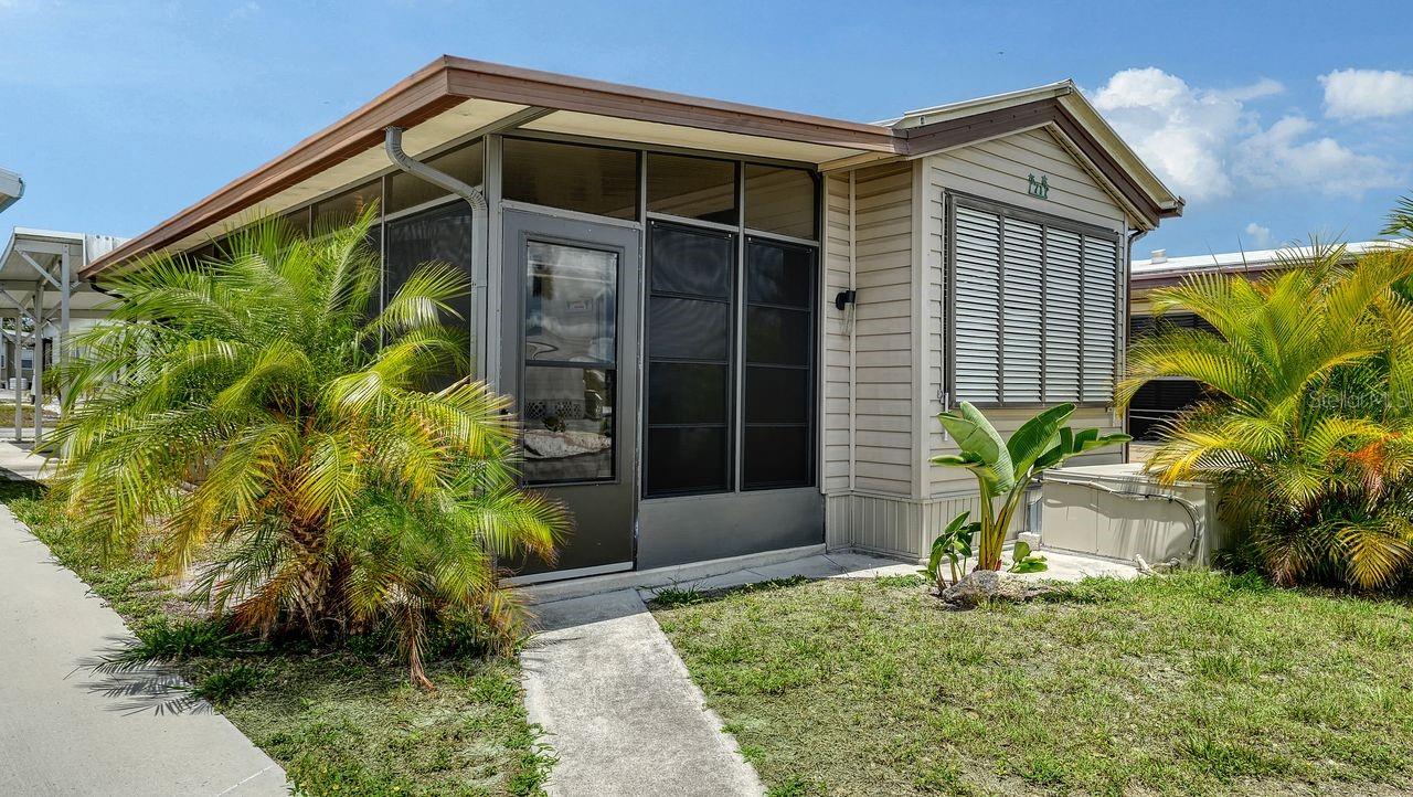 Welcome to Holiday Travel Park, where affordability, coastal living, and an active lifestyle come together in one of Englewood’s most loved 55+ communities. Perfectly positioned on ONE OF THE BEST LOTS IN THE COMMUNITY, this FULLY FURNISHED AND TURNKEY home sits along a QUIET, PEACEFUL STREET surrounded by tropical landscaping and the kind of relaxed atmosphere people move to Florida to enjoy. Inside, the home feels bright, fresh, and surprisingly spacious thanks to the OPEN FLOOR PLAN, ABUNDANT NATURAL LIGHT, FRESH INTERIOR PAINT, and BRAND NEW LUXURY VINYL FLOORING THROUGHOUT. Thoughtful upgrades continue with DESIGNER LIGHTING, ALL-NEW APPLIANCES, including a STACKABLE WASHER AND DRYER, plus an impressive amount of STORAGE CABINETRY that makes everyday living easy and organized. The FLORIDA ROOM WITH NEW SCREENS creates the perfect extra space to enjoy morning coffee, relax with friends, or simply open the windows and let the Florida breeze roll through. Outside, the beautifully maintained landscaping and private STORAGE SHED add both charm and practicality. Best of all, YOU OWN THE LAND, giving you one of the most attractive and affordable opportunities to enjoy the Florida lifestyle without sacrificing location or amenities. The LOW HOA FEES cover WATER, SEWER, AND TRASH, helping keep living simple and budget-friendly, while optional BOAT AND RV STORAGE adds flexibility for those ready to fully embrace the coastal lifestyle. Life inside Holiday Travel Park stays active year-round with a LARGE SALTWATER COMMUNITY POOL, SHUFFLEBOARD, BOCCE BALL, HORSESHOES, INDOOR PICKLEBALL, POOL TABLES, CARD GAMES, LINE DANCING, social events, and a vibrant ACTIVITIES CENTER that keeps neighbors connected and the calendar full. Boating and fishing enthusiasts will especially appreciate the COMMUNITY BOAT RAMP, nearby marinas, and easy GULF ACCESS, making days on the water part of everyday life. And when it’s time for the beach, you’re only about 10 minutes from the beautiful shores of Englewood Beach, with nearby parks, nature trails, local restaurants, waterfront dining, and shopping all close by. Whether you’re searching for a seasonal retreat, full-time residence, or investment with strong rental appeal, this property delivers the rare combination of VALUE, LOCATION, LIFESTYLE, AND OWNERSHIP that’s becoming harder and harder to find along the Gulf Coast.