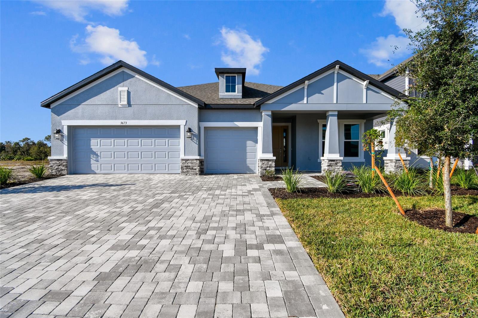 Welcome to Creeks Edge at Twin Rivers — where modern comfort meets the Florida lifestyle you've been dreaming of. Escape the noise and discover the perfect balance of space, privacy, and convenience. Nestled within one of the area's most desirable gated communities, this beautifully designed 3-bedroom, 3-bath home offers a refreshing blend of peaceful country-style living and easy access to shopping, dining, and major commuting routes. From the moment you step inside, you'll be greeted by an open, light-filled floor plan thoughtfully designed for both everyday living and effortless entertaining. The spacious great room flows seamlessly into the dining area and kitchen, creating an inviting atmosphere where family and friends naturally gather. At the heart of the home, the chef-inspired kitchen features stylish cabinetry, generous counter space, a walk-in pantry, and a large center island perfect for meal preparation, casual dining, or hosting guests. Expansive sliding glass doors lead to the covered lanai, extending your living space outdoors and providing the ideal setting for morning coffee, evening relaxation, or weekend gatherings. The owner's suite serves as a private retreat, offering abundant natural light, dual vanities, a spacious walk-in shower, and a large walk-in closet. Two additional bedrooms and well-appointed bathrooms provide comfortable accommodations for family members and guests alike. M/I Homes has many standard features that most builders call 'upgrades'.  Impact glass, spray foam insulation and dehumidifier are just a few of the features that makes M/I one of the best selling builders in SW Florida. Situated on a spacious homesite within the sought-after Twin Rivers community, this home offers the tranquility of a natural setting while remaining close to everything you need. Built with quality craftsmanship and modern features, including impact windows and a 10-year transferable structural warranty, you'll enjoy peace of mind for years to come. If you've been searching for a home that offers more space, more privacy, and a lifestyle centered around comfort and convenience, Creeks Edge at Twin Rivers may be exactly what you've been waiting for.