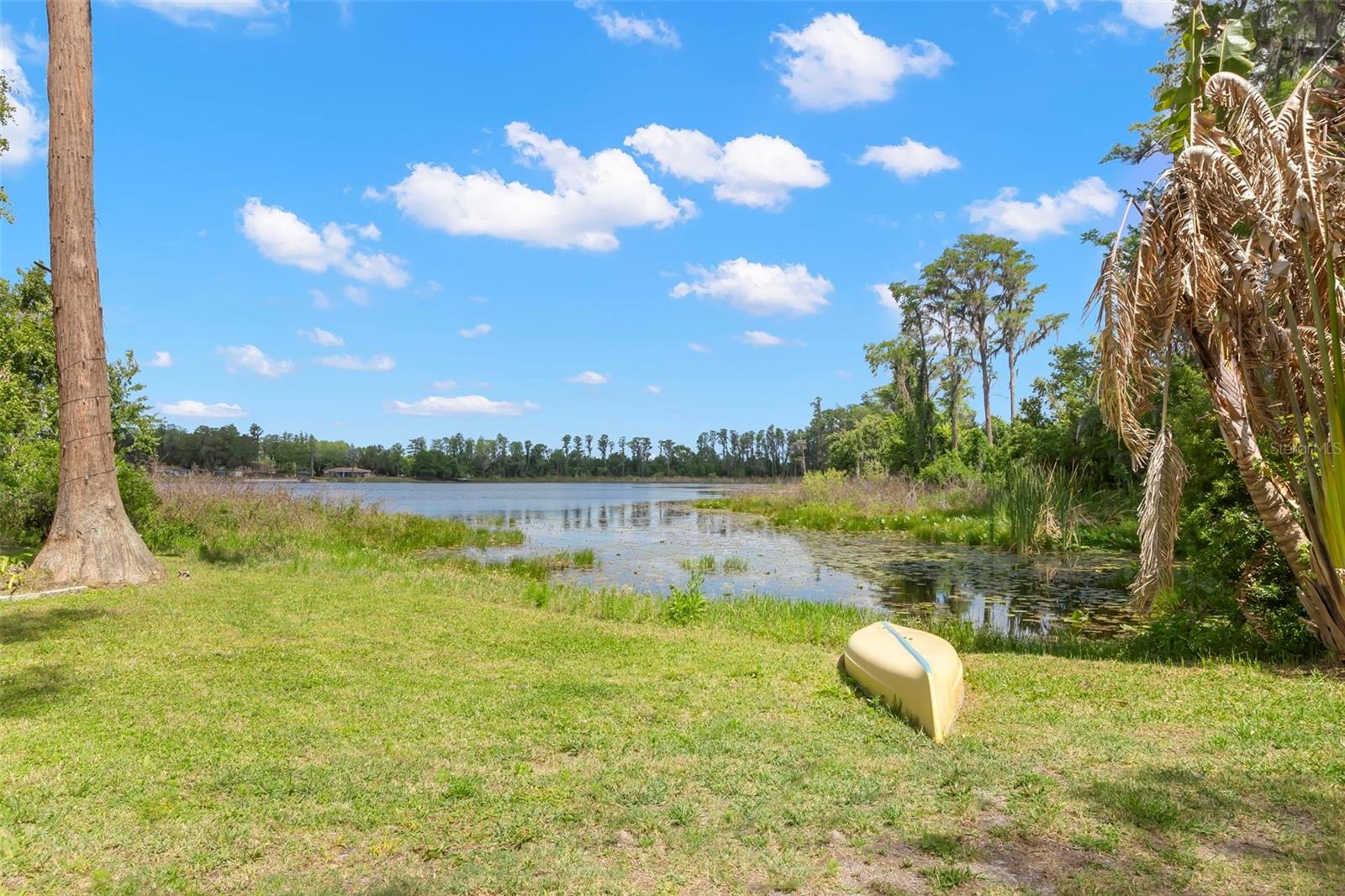 Set between the open waters of Lake Harvey and the quiet shoreline of Lake Joy, this dual-lakefront residence offers a rare balance of energy and calm. The setting is both expansive and intimate, designed for those who value recreation, privacy, and a seamless connection to the natural landscape.

Spanning nearly 4,000 square feet, the home is composed with intention. The main-level primary suite opens directly to the outdoor living spaces, creating a natural flow between interior comfort and the lakefront setting. A spacious bath with dual vanities and a walk-in shower completes the retreat. The main level also includes a formal dining room, a dedicated office, and a guest bedroom with full bath, providing both functionality and flexibility.

Upstairs, two generously proportioned ensuite bedrooms offer privacy and quiet separation for family and guests.

Outdoors, the home transitions effortlessly into a resort-like environment. A pool and spa, outdoor fireplace, and expansive wraparound terrace with fountain are oriented toward the water, offering an ideal setting for both entertaining and quiet reflection. The landscape is alive with native wildlife, from wading birds to otters along the shoreline, reinforcing the sense of retreat.

What distinguishes the property is its access to two complementary lakes. Lake Harvey, a ski lake, invites boating, waterskiing, and open-water recreation. Lake Joy provides a more tranquil experience, suited to kayaking, paddleboarding, and fishing.

An oversized garage with capacity for 6+ vehicles offers exceptional versatility for collectors, storage, or workshop use.

Constructed with steel-reinforced insulated concrete forms (ICF), the residence offers a level of durability and efficiency rarely found in lakefront homes, delivering superior structural integrity, energy performance, and sound insulation. The exterior is finished with a low-maintenance stucco system designed for longevity.

Recent updates and system improvements further enhance the home’s turnkey appeal, including a new roof and gutter system (March 2026) and fresh interior paint (March 2026). Within the past five years, major components have been thoughtfully updated, including air conditioning systems, UV-C air purification, built-in refrigerator, outdoor grill, well pump, septic pump, water softener, and a motorized garage door, providing both comfort and confidence in the home’s infrastructure.

Positioned with notable convenience, the property is a short drive from Tampa International Airport, TPC Tampa, and the Gulf Coast’s renowned beaches. Shopping, dining, and an equestrian center are just minutes away, while the home is also located within the highly regarded Steinbrenner school district.

A residence defined by water, craftsmanship, and quiet permanence.