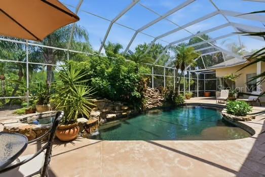 One or more photo(s) has been virtually staged. Located on one of the most exclusive streets in Cheval.......Welcome to 18701 Pepper Pike in Cheval Golf and Counrty Club.
A rare opportunity to own a 6,200+ sq ft estate on over an acre—perfectly positioned on Hole 1 and enveloped in lush, mature landscaping that creates a private, garden-like sanctuary. Tucked behind a fully fenced setting with beautiful greenery, the property offers a level of privacy rarely found, evoking the feeling of a secluded secret garden retreat within one of Tampa’s most sought after gated communities.
From the moment you arrive, the home’s scale and presence are undeniable. Inside, a grand yet inviting layout unfolds with 6 bedrooms, 4.5 bathrooms, and a collection of thoughtfully designed living spaces ideal for both elegant entertaining and everyday comfort. Formal living and dining rooms set a refined tone, while the expansive game room with a striking brick fireplace and a dedicated bonus/theater room provide exceptional flexibility for hosting and relaxation.
Designed with both functionality and privacy in mind, the home features distinct living wings. The primary wing serves as a true retreat, offering the luxurious owner’s suite along with three additional bedrooms—two connected by a Jack-and-Jill bathroom and one with its own private en suite—creating an ideal configuration for family living. A separate guest wing includes two additional bedrooms joined by a beautifully appointed Jack-and-Jill bathroom, perfectly suited for guests, extended family, or a quiet home office environment.
At the heart of the home, the spacious kitchen flows seamlessly into a large family room anchored by a grand brick wood-burning fireplace, creating a warm and welcoming central gathering space. LVP flooring throughout the bedrooms, living room, and family room adds a clean, modern touch while maintaining durability and style.
The primary suite is a true sanctuary, highlighted by a fully renovated, spa-inspired bathroom (2023). All guest bathrooms have also been tastefully updated (2023) with timeless finishes, offering a cohesive sense of understated luxury throughout.
Step outside to a private resort-style setting where a lagoon-style pool with a dramatic rock waterfall and hot tub serves as the centerpiece of an expansive lanai with over 3000 sq ft of entertaining space.Outside of the lanai is surrounded by mature landscaping and open green space, the backyard is designed for both peaceful relaxation and effortless entertaining.
Recent improvements include a new ROOF (2022), three HVAC systems (2022), and a TANKLESS HOT WATER HEATER (2023), providing modern comfort and peace of mind.
As a resident of Cheval Golf & Country Club, enjoy access to exceptional amenities including a clubhouse with dining, tennis courts, fitness center, and swimming facilities, all within a 24-hour manned gated community. The championship golf course is private and available by optional membership.
Ideally located within the highly sought-after Steinbrenner school district, Cheval offers a premier lifestyle just minutes from top-rated dining, shopping, and major highways, with convenient access to downtown Tampa and Tampa International Airport—both approximately 20 minutes away.
Offering exceptional value for its size, setting, and location, this is a rare opportunity to secure a true estate property in Cheval—where homes of this scale and privacy seldom come to market.