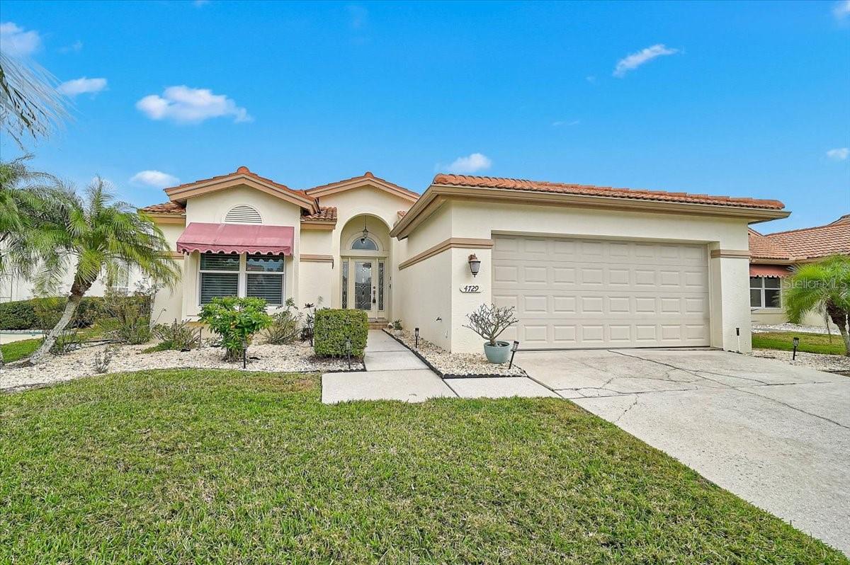 Welcome to easy Florida living in the highly desirable Peridia Golf & Country Club, a socially active, pet-friendly community known for its welcoming atmosphere and resort-style amenities. This well maintained, maintenance free patio pool home offers the perfect blend of comfort, convenience, and recreation. Featuring 2 bedrooms and 2 full bathrooms, the home is thoughtfully designed for relaxed everyday living or seasonal enjoyment. The kitchen features granite counter tops, ample cabinet space, breakfast bar and an eat-in breakfast dining area. The primary suite features a walk-in closet, en suite bathroom with dual sinks, soft closing drawers, granite counter tops, and shower. The guest bathroom features granite counter tops and a tub shower combo set up. Step outside to your large private screened in patio to include a duel heated pool(solar and electric), ideal for morning swims or evening relaxation. Recent updates include a new pool cage (2025) and new pool pump (2025), providing peace of mind and added value. As an added protection, the commercial overhead garage door is hurricane rated and a portable whole home generator was installed in May of 2026. Enjoy even more assurance with a one-year home warranty included at closing. The outdoor space offers privacy and year-round enjoyment, making it a true extension of the home. Included in your fees is the grounds maintenance, irrigation, cable, internet and your Peridia Golf & Country Club membership, granting residents access to an impressive array of resort-style amenities. Enjoy golfing at Manatee Counties top rated Premier Executive Golf Course, friendly matches on the tennis and pickleball courts, or unwind at the heated community pool. The vibrant clubhouse serves as the heart of the community, featuring an indoor bar and restaurant as well as a popular tiki bar—perfect for social gatherings, dining, and events. Ideally located, this home is just minutes from SRQ Airport, Interstate 75, University Town Center Mall, Mote Marine Aquarium, top-rated medical facilities, and a wide variety of shopping and dining options. Plus, you’re a short drive from some of the best beaches in America, offering the quintessential Florida lifestyle. Whether you’re seeking a full-time residence or a seasonal retreat, this home offers comfort, convenience, and an unbeatable community experience. Be sure to ad this to your "must see" list of homes to tour. Private showings now available. Ask about buyer incentives available!