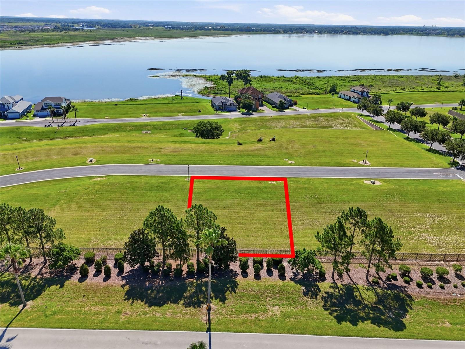 Build your custom home in Water Ridge, one of Central Florida's premier gated lake communities in Lake Alfred, Florida. This homesite presents an opportunity to design and build a custom residence surrounded by the natural beauty of Lake Alfred, Lake Van, and Lake Medora. Water Ridge offers an impressive collection of resort-style amenities including a clubhouse, fitness center, multiple swimming pools, lap pool, tennis courts, pickleball courts, basketball court, walking trails, boat docks, and community lake access. Enjoy boating, fishing, kayaking, paddleboarding, and an active outdoor lifestyle in a community designed to take advantage of Florida's year-round sunshine. Ideally situated in Polk County between Orlando and Tampa, this location provides convenient access to Interstate 4, major employment centers, shopping, restaurants, medical facilities, golf courses, and entertainment. Nearby destinations include LEGOLAND Florida Resort, the Winter Haven Chain of Lakes, Downtown Winter Haven, Downtown Lakeland, and Bok Tower Gardens. Whether you are seeking a custom luxury home site, primary residence location, or seasonal Florida retreat, Water Ridge offers the perfect blend of recreation, convenience, and lake community living. Experience the Florida lifestyle in a gated community known for its amenities, scenic surroundings, and central location. Buyer and buyer's agent to verify all information deemed important including lot size, dimensions, HOA regulations, building requirements, utility availability, zoning, and school assignments.