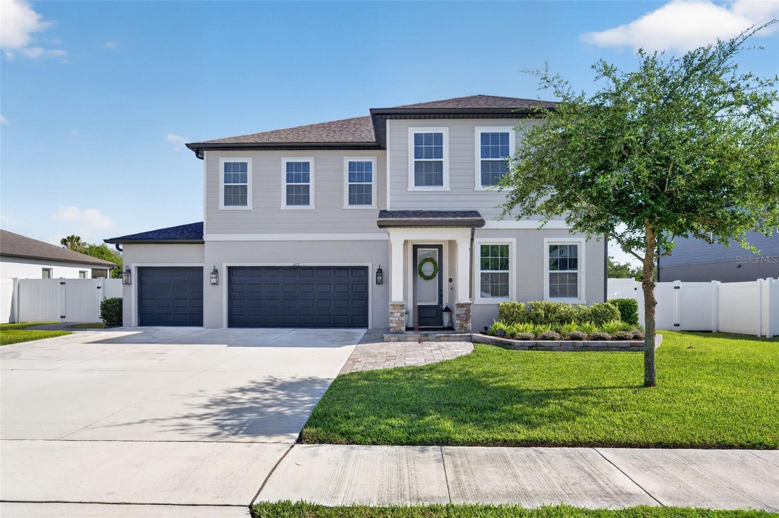 Beautifully upgraded and move in ready, this Hampton Oaks home combines modern style with everyday functionality. Inside, you’ll find an open layout filled with natural light, a stunning kitchen with a large quartz island, 42 inch cabinetry, stainless steel appliances, and a butler’s pantry.

Additional highlights include a dedicated office with custom built ins, electric fireplaces, a custom primary closet, and a versatile three car garage featuring epoxy flooring and a mini split AC system.

Enjoy Florida living with a screened lanai, extended paver patio, and fully fenced backyard, plus countless thoughtful upgrades throughout the home including solar shades, crown molding, custom shelving, trim work, and a water softening/reverse osmosis system.

Conveniently located near I 4 with easy access to Orlando, shopping, dining, and area beaches.