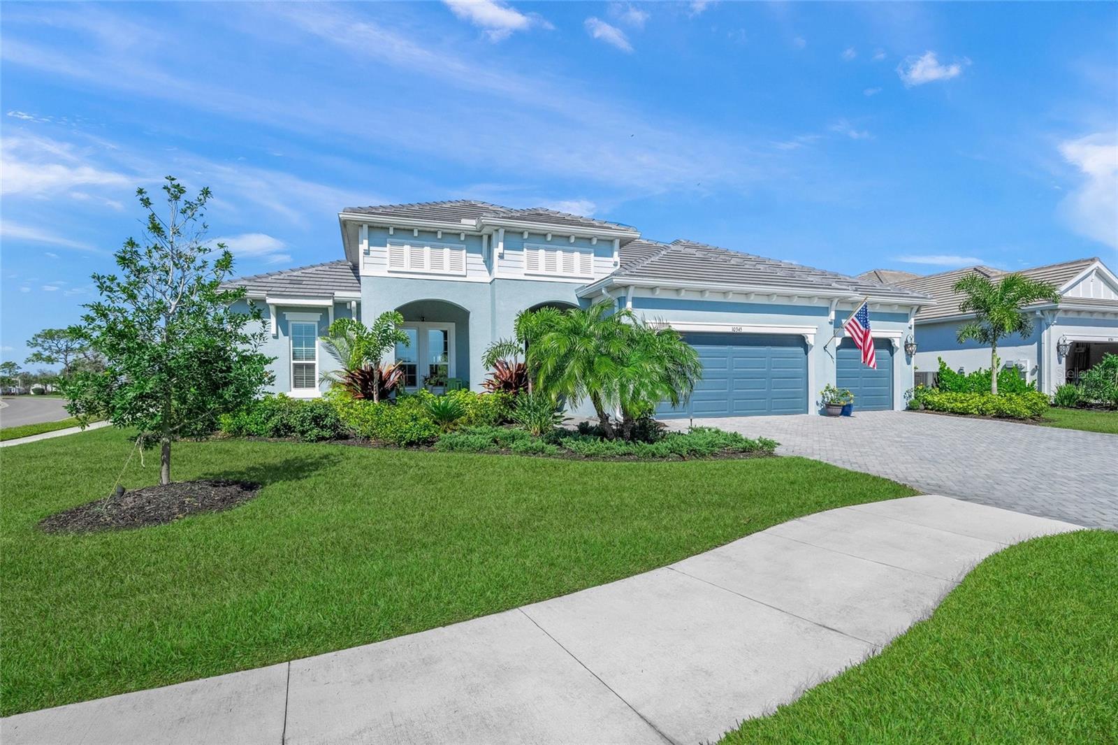 This is the one * PERFECTLY POSITIONED ON A LARGE 1/2 ACRE LOT BACKING TO A GREENBELT * ACROSS THE STREET IS A COMMUNITY PARK & GREENSPACE * IMPACT HURRICANE GLASS & DOORS THROUGHOUT * No neighbors on 3 sides * Short walk to the World Class Resort Amenities offered in Grand Park * Immaculate home * PRIDE OF OWNERSHIP SHOWS * Only 2 years young * Why build and have all the headaches? * Why wait when you can have your dream home now?! * Your custom Kiawah model showcases DESIGNER APPOINTED FINISHES FROM ARHAUS INCLUDING CUSTOM LIGHTING & CUSTOM FANS * Whole House Water Softener * 2025 Outdoor Kitchen with Professional Grill, Exhaust Fan/Hood, Granite Countertops & Bar Seating * Your OUTDOOR OASIS features a Custom Saltwater Pool & Spa are heated with NATURAL GAS * Brick Deck with SPACIOUS Covered Lanai * This is the perfect home to entertain family & friends or simply relax in your slice of paradise * 4 Bedrooms PLUS a separate Office * 3 Full Baths * 3 Car Garage * The Chef's Gourmet Kitchen is a dream with NATURAL GAS 5 BURNER COOK-TOP & BUILT-IN WALL OVEN * The large Kitchen QUARTZ island is the perfect gathering spot * This home has an ABUNDANCE OF NATURAL LIGHT with corner pocket sliding glass doors to your outdoor living * The Primary Suite is a true retreat with a 12x10 Walk-in Closet & a MUST SEE Spa-style Bath * Split Plan Design * 10 foot Coffered Ceilings *  This home cannot be replicated at this price * Most of the builder features have been REPLACED WITH NEW FIXTURES & QUALITY FINISHES * This home will not disappoint * Grand Park is GATED and enjoys WORLD CLASS AMENITIES * 2 Resort-style Pools, Clubhouse, Fitness Center + Aerobics Studio, Pickleball, Sports Court, Tennis Courts * WE ARE HAPPY TO GIVE A TOUR OF THE AMENITIES * Miles of Walking Trails, Park, Playground & Greenspace * This is a VIBRANT COMMUNITY * One look & you'll fall in love *