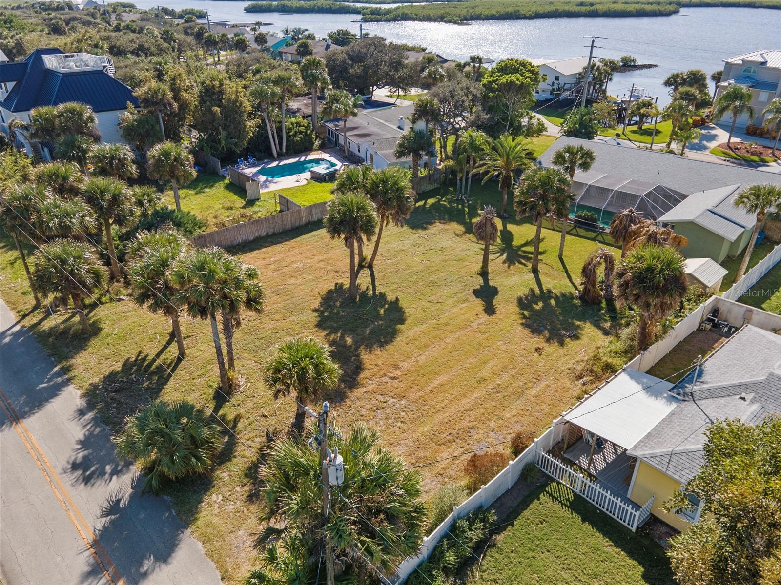 Discover a rare chance to live your coastal dream in the charming, laid-back community of Wilbur-By-The-Sea! Opportunities like this are few and far between — vacant land here is nearly impossible to find, making this beautiful lot a true gem. Build the beachside retreat you've always imagined, just moments from the peaceful, no-drive stretch of sandy shoreline that locals treasure. Wake up to salty breezes, take sunset strolls, and enjoy the quiet, coastal lifestyle that makes Wilbur-By-The-Sea so special. Whether you envision a full-time residence or a relaxing getaway, this lot offers the perfect blank canvas. Don't miss your chance to own a piece of paradise in one of the last places where untouched land still exists on beachside! Located just north of Ponce Inlet with nearby marinas, parks, shopping, restaurants and boat ramps. Your beach-life adventure starts right here!