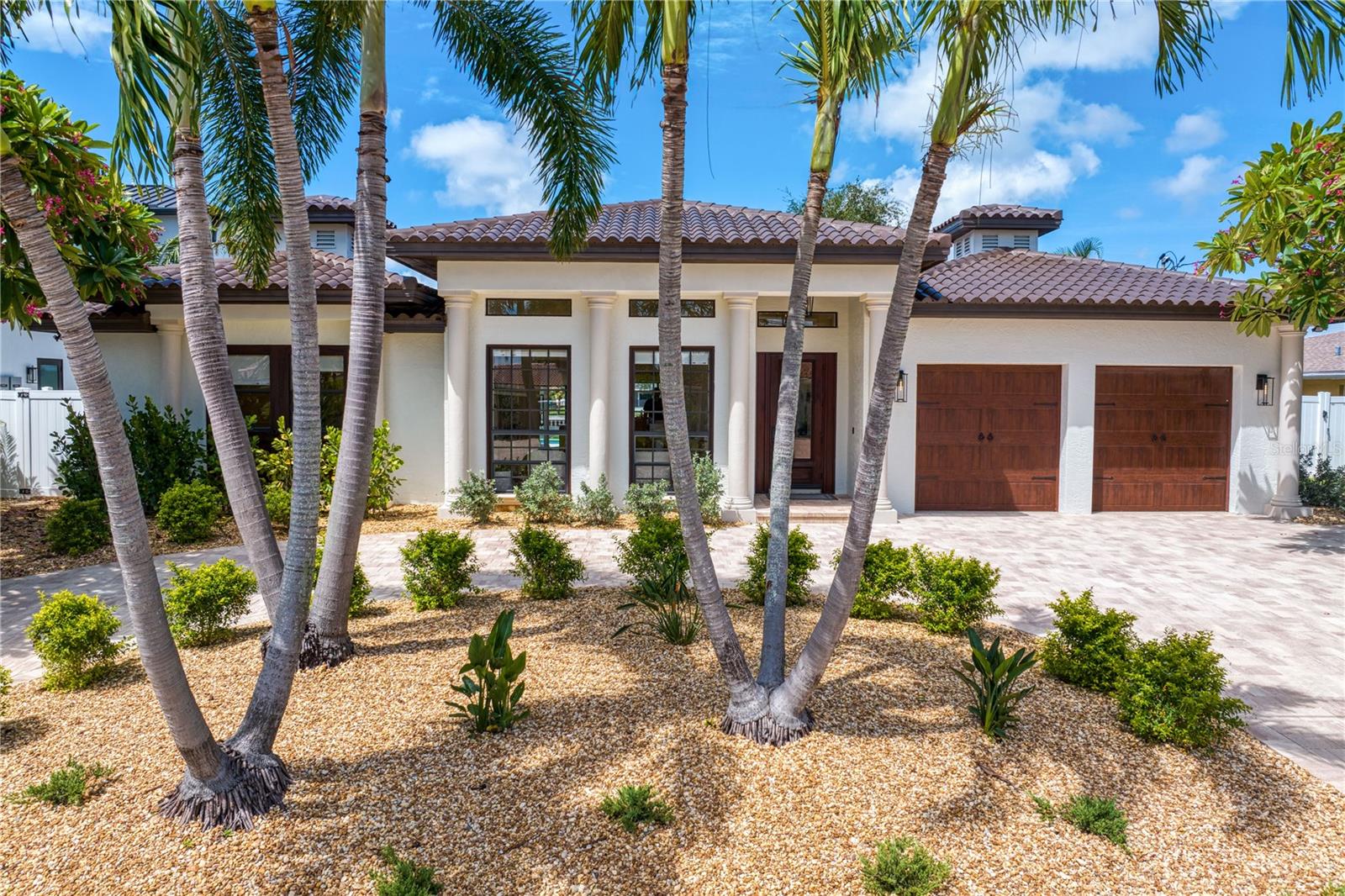 REMARKABLE BASE ELEVATION OF 14 FEET.  DID NOT EXPERIENCE ANY FLOOD WATER INTRUSION DURING HURRICANE HELENE!  Welcome to your dream home! Nestled on a picturesque waterfront homesite elevated far above the FEMA base flood elevation, this stunning single-story residence has been meticulously remodeled from top to bottom. Showcasing luxury finishes throughout, this home offers an unparalleled blend of modern elegance and serene waterfront living. The open-concept layout seamlessly integrates indoor and outdoor spaces, perfect for both relaxation and entertaining. Rest easy knowing that all-new electrical, plumbing, duct work, insulation, and A/C systems provide exceptional comfort, efficiency, and peace of mind for years to come.

Step inside to be greeted by a light-filled interior where every detail has been carefully curated. Solid core doors throughout enhance both privacy and sophistication.  The spacious living area boasts high ceilings and an abundance of natural light providing breathtaking water views, creating a seamless connection to the expansive outdoor deck. The chef’s kitchen is a culinary masterpiece, featuring top-of-the-line stainless steel appliances, sleek custom cabinetry, and exquisite leathered quartzite countertops that enhance both beauty and functionality.

The luxurious master suite is a tranquil oasis with direct access to the pool area via sliding glass doors, a spa-like ensuite bath adorned with premium fixtures, and two generously sized walk-in closets that provide ample storage and convenience. The three additional bedrooms are equally refined, offering comfort and style with high-end finishes that ensure a welcoming atmosphere for family and guests. An office provides a dedicated space for work or study, while the oversized garage offers ample room for vehicles and an abundance of additional storage.

Outside, a brand-new dock awaits, complete with a 16,000 lb boat lift—ideal for securely storing your boat and enjoying effortless waterfront access. The west-facing remodeled pool area, with all new equipment, is a true highlight, offering stunning sunset views that provide a spectacular backdrop for evening swims and outdoor gatherings. The expansive deck is perfect for hosting memorable events, or simply relaxing by the water. The lush newly landscaped grounds complete with all new irrigation system further enhance the home’s curb appeal and provide additional space for outdoor enjoyment.

With its prime location, comprehensive updates and luxury finishes throughout, this home is set to impress the most discerning buyer.